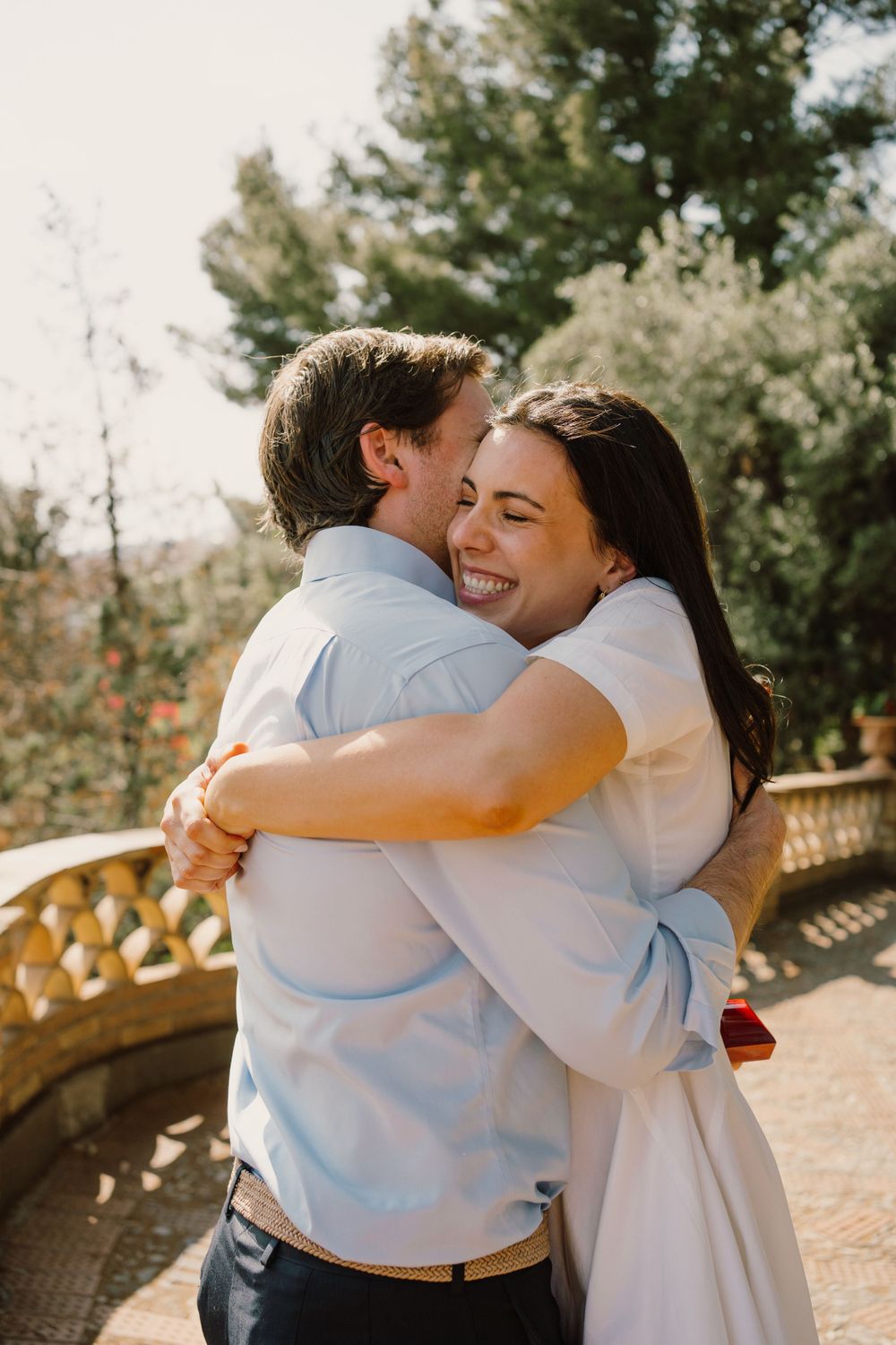 Bride-to-be giving a hug after the proposal in Italy