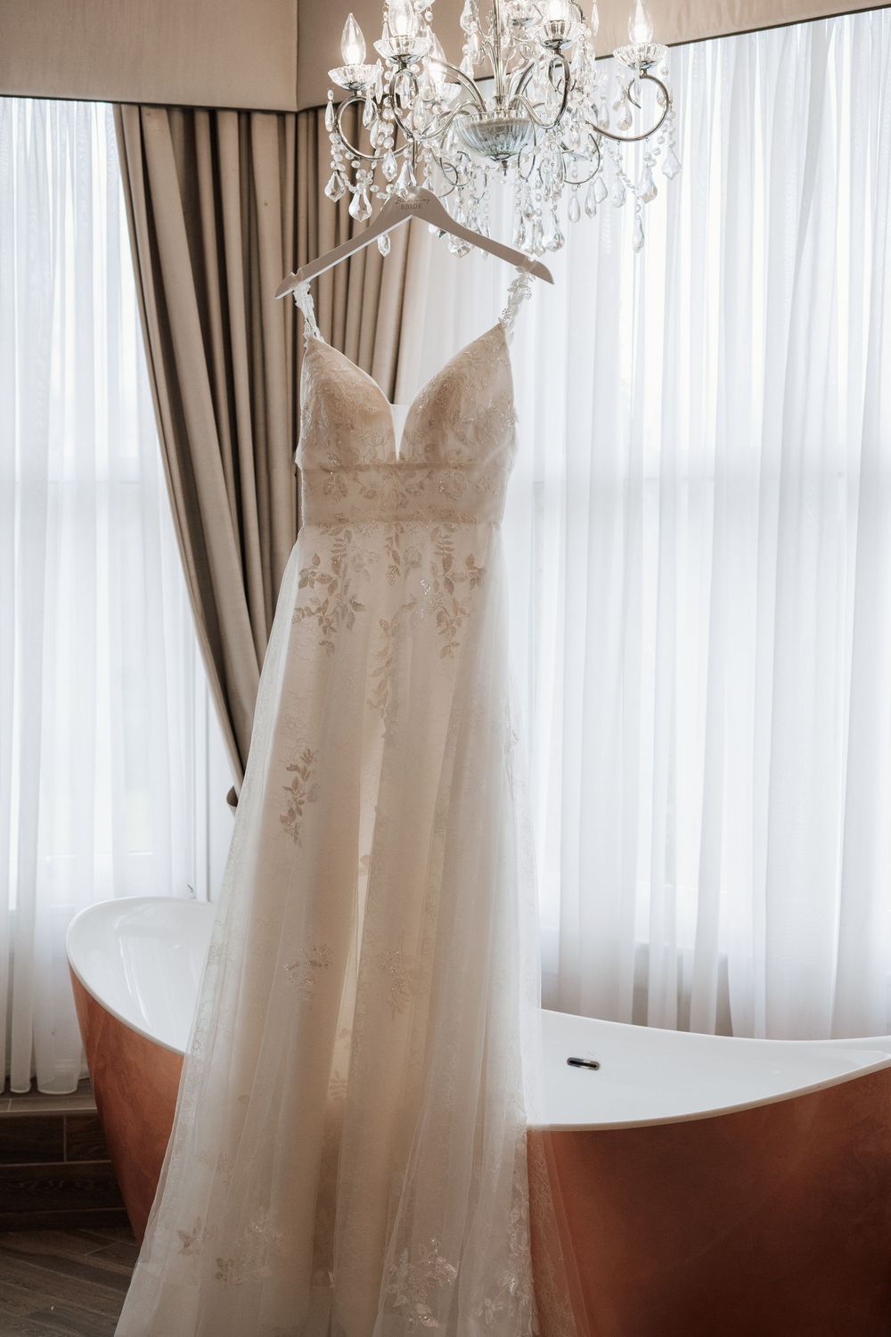 bartle hall Preston, Lancashire, hotel, wedding dress hanging up, editorial photography, white wedding, alternative wedding