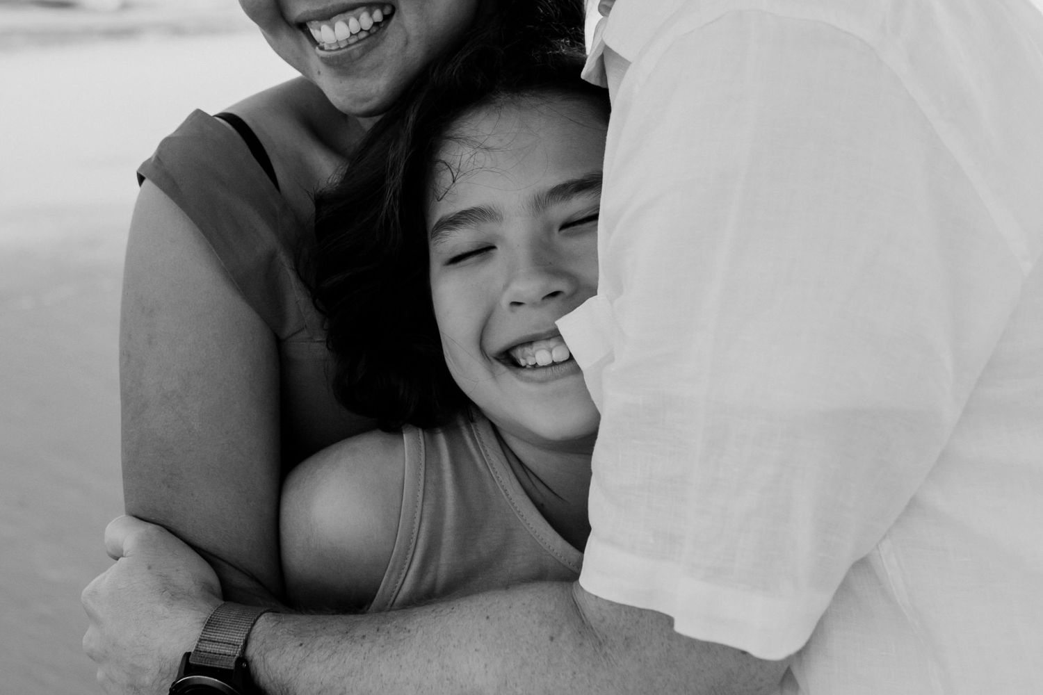 Intimate black and white photograph capturing a tender hugging moment.