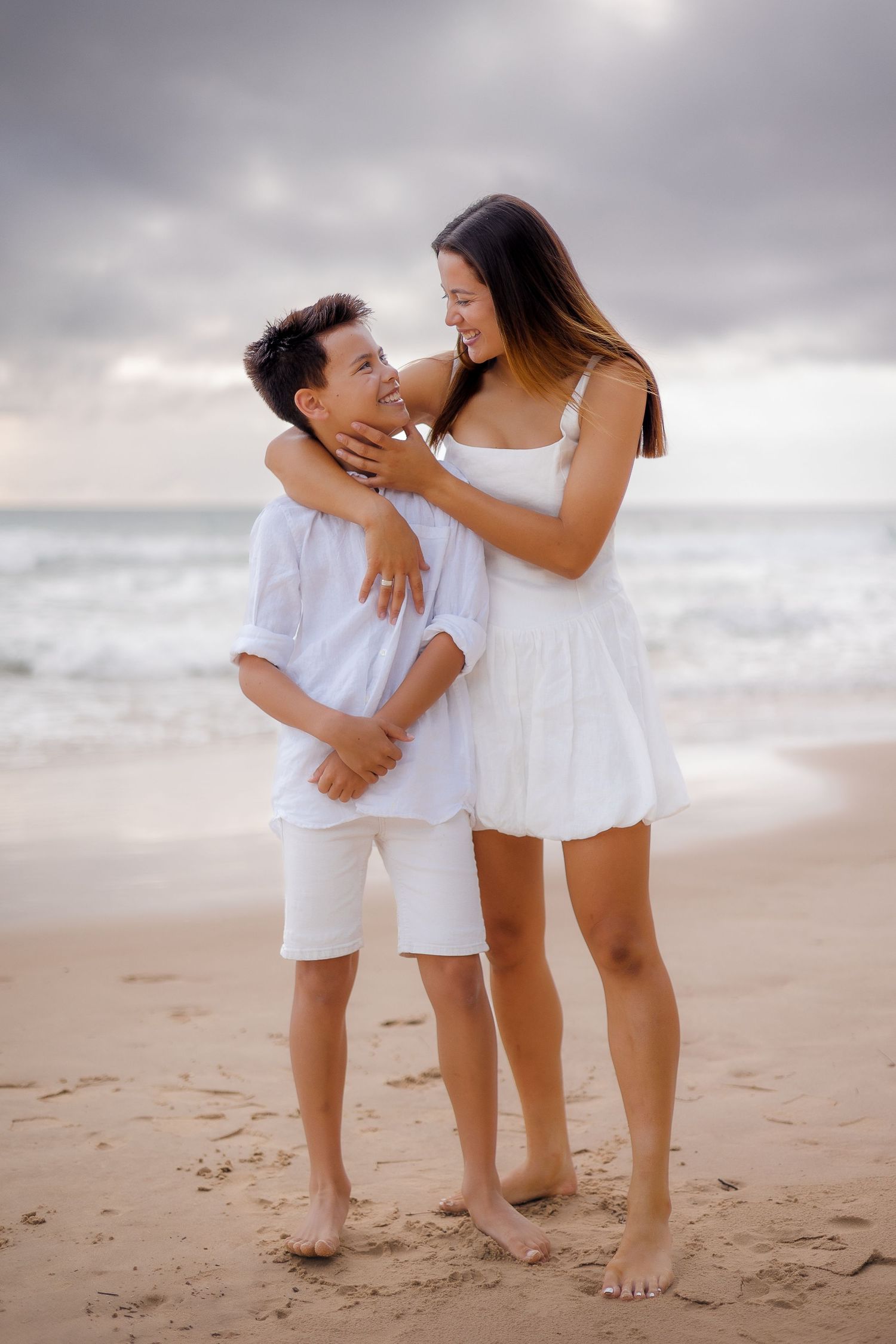 family photoshoot at Kawana Beach, Sunshine Coast, capturing smiles and laughter in the early morning light between brother and sister