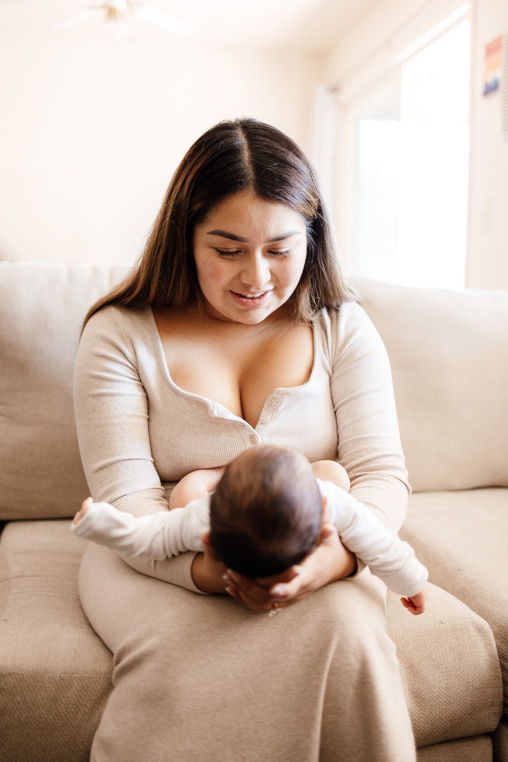 mom looks at baby at newborn photoshoot with Bay Area Newborn Photographer Cindy Tucey in Campbell
