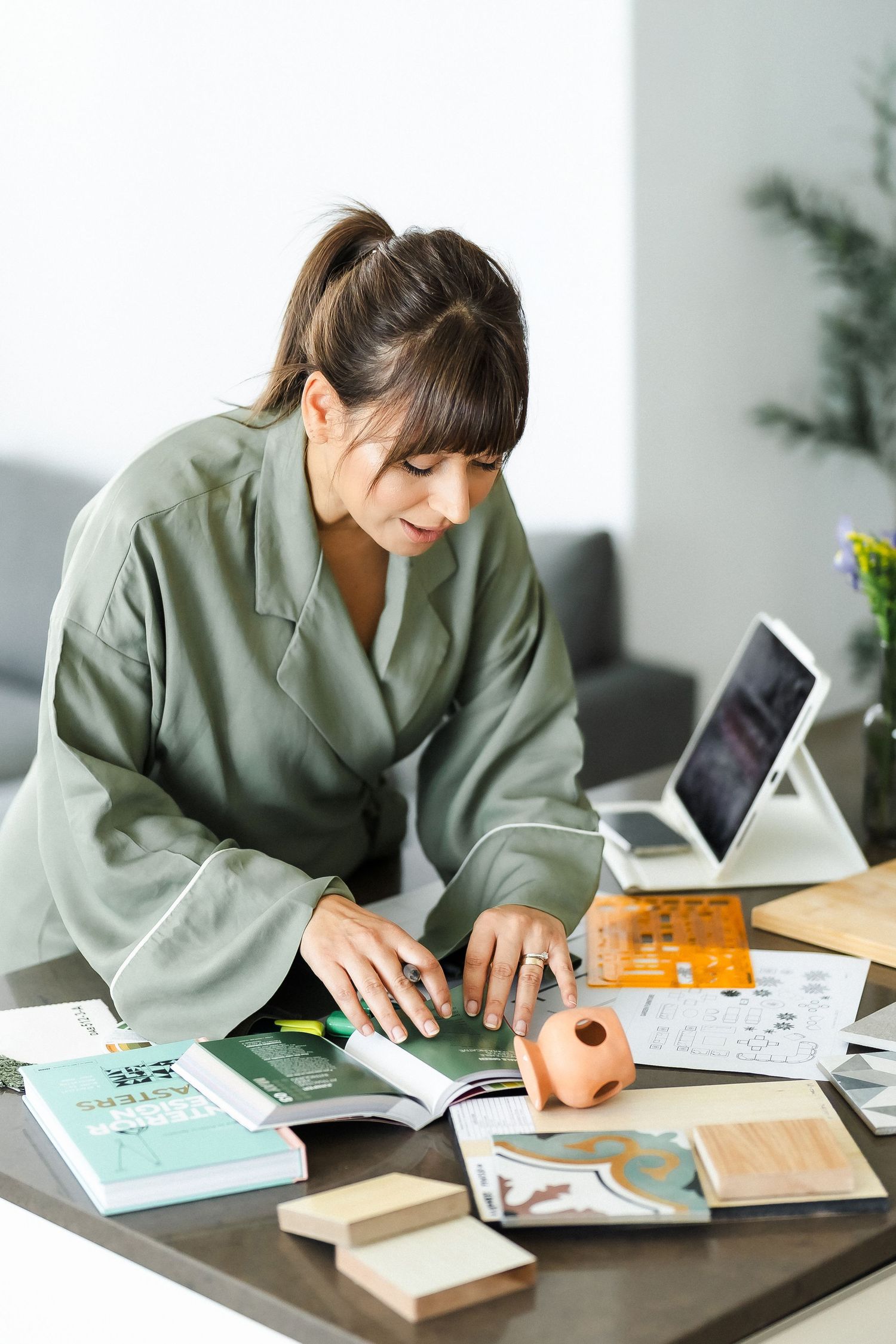 Business portrait photography session of creative professional at workspace