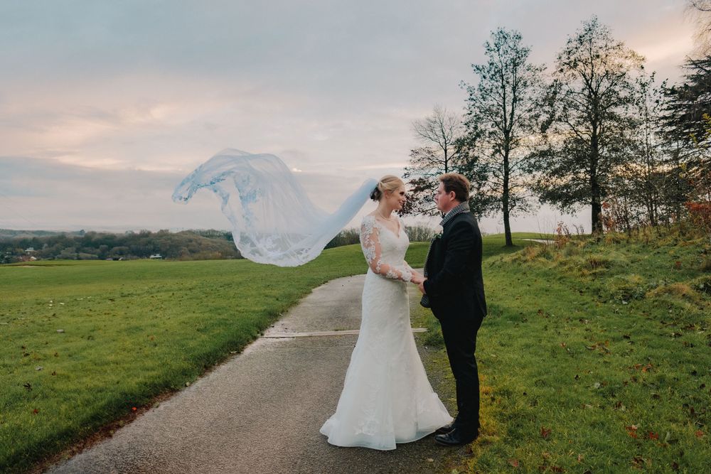 A romantic wedding photo sequence showing a couple in formal attire on a scenic hilltop path at sunset.