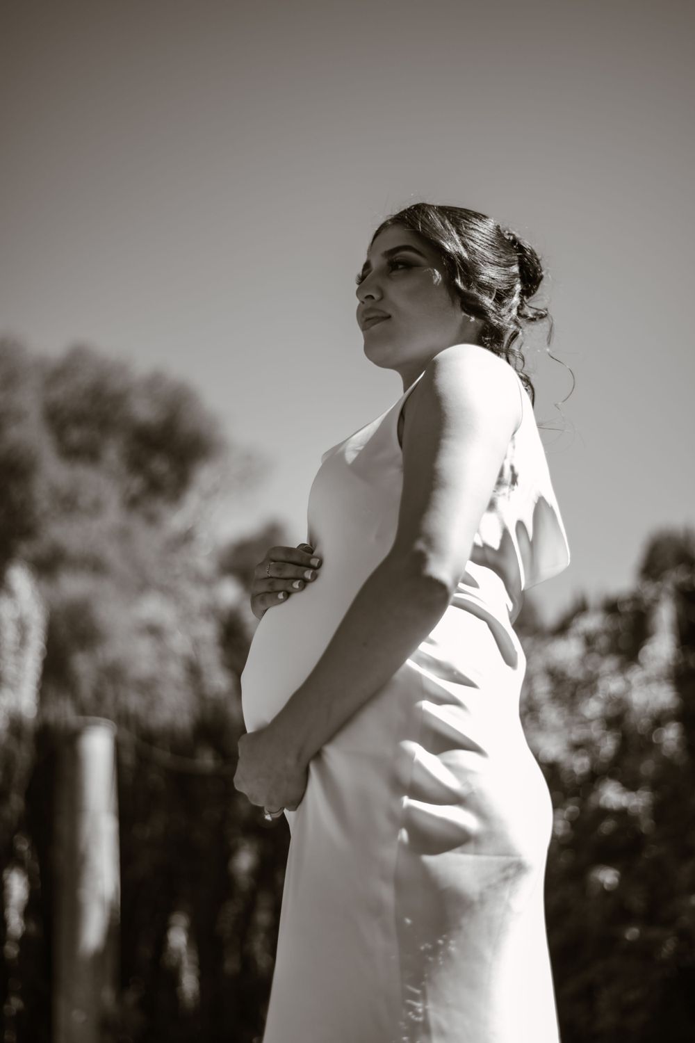 Minimalist black and white photography capturing elegant movement in a garden setting.