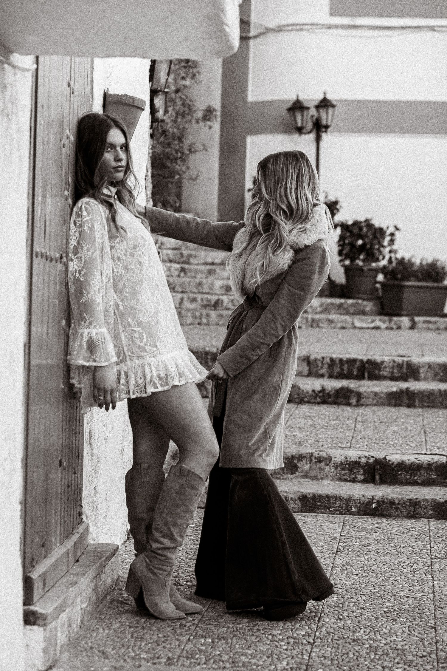 Artistic black and white photo series featuring lace clothing and boots.