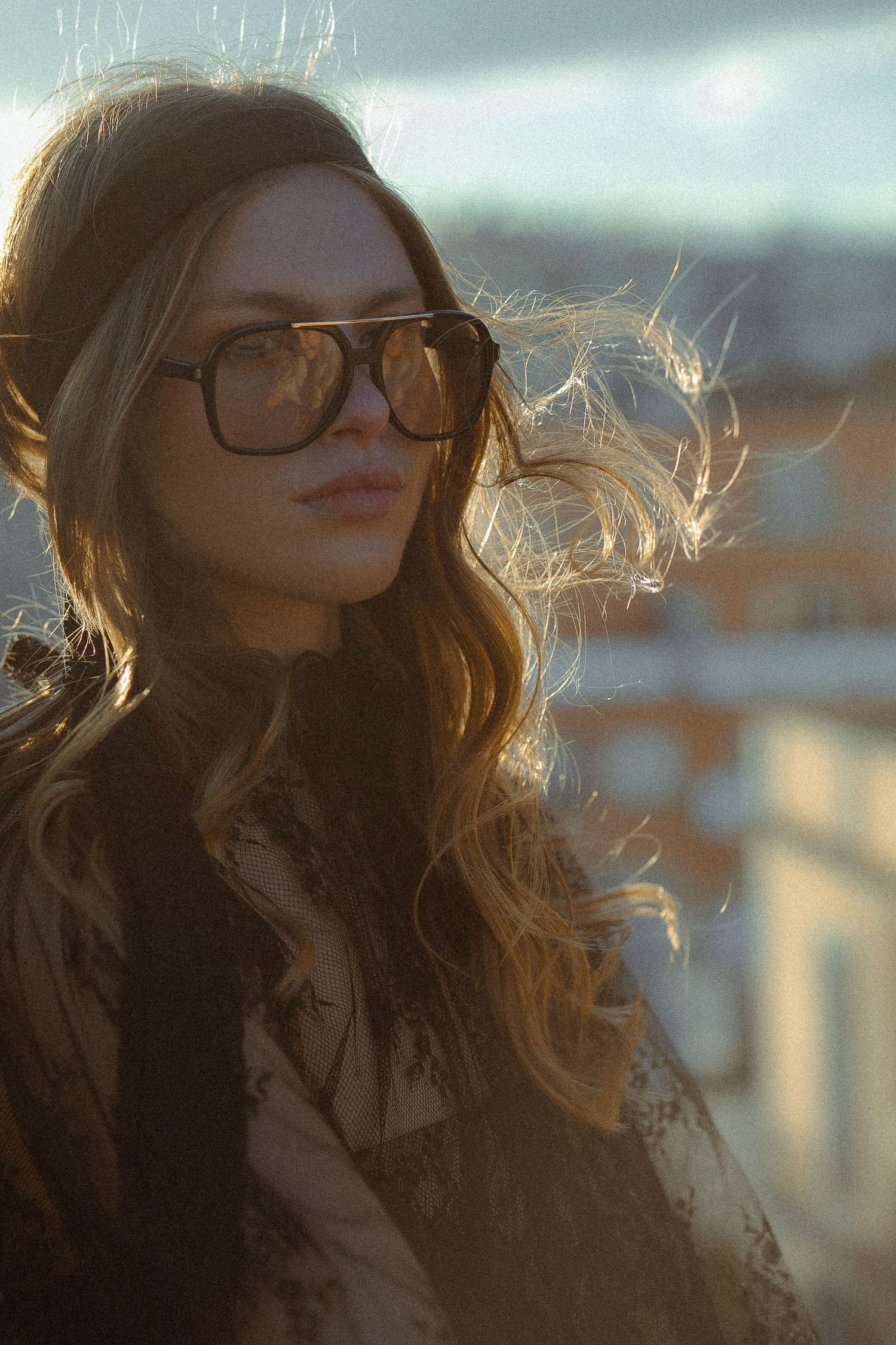 Backlit portrait series showing windswept hair and glasses in golden sunlight.