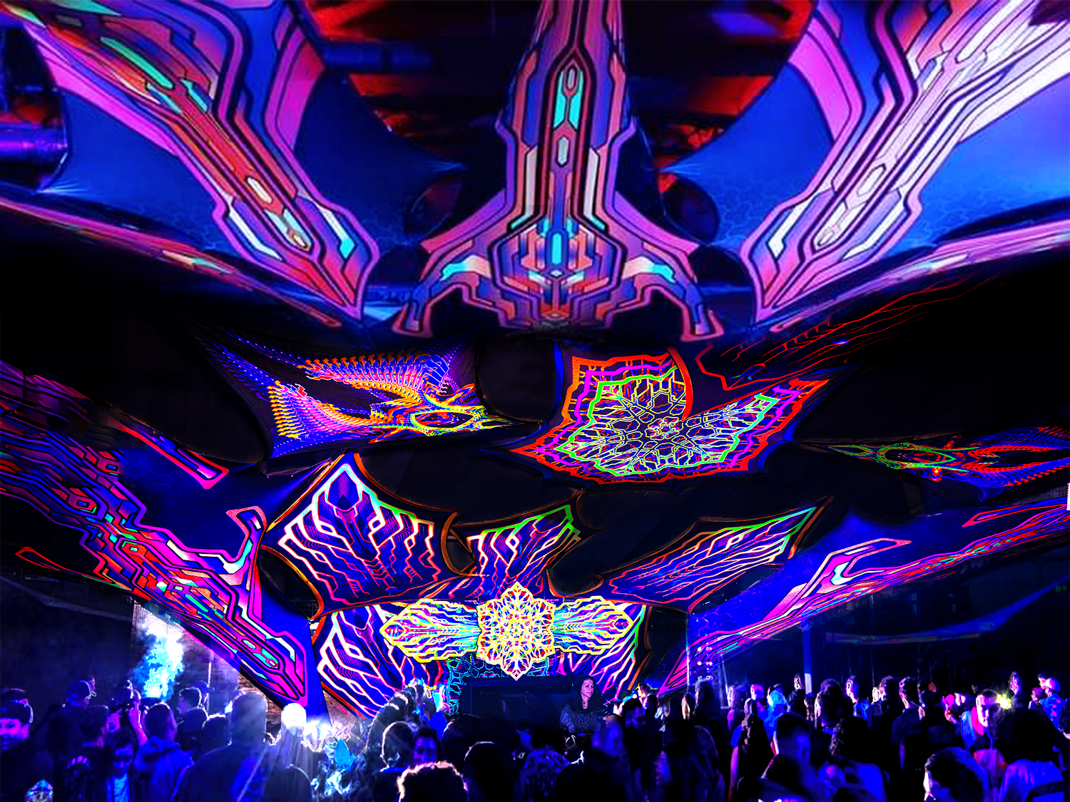 Wide view of an abstract, geometrically decorated stage with a large crowd at psy-rave event. Bomblastic radion amsterdam Bom voyage vivitu