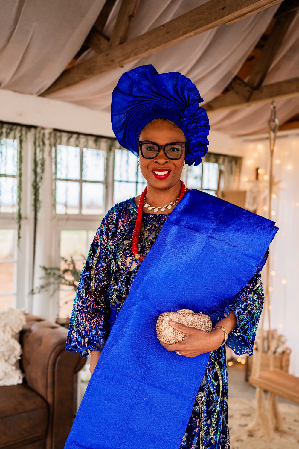 Vibrant blue headwrap and sequined outfit ensemble shown in multiple poses against a white interior setting.