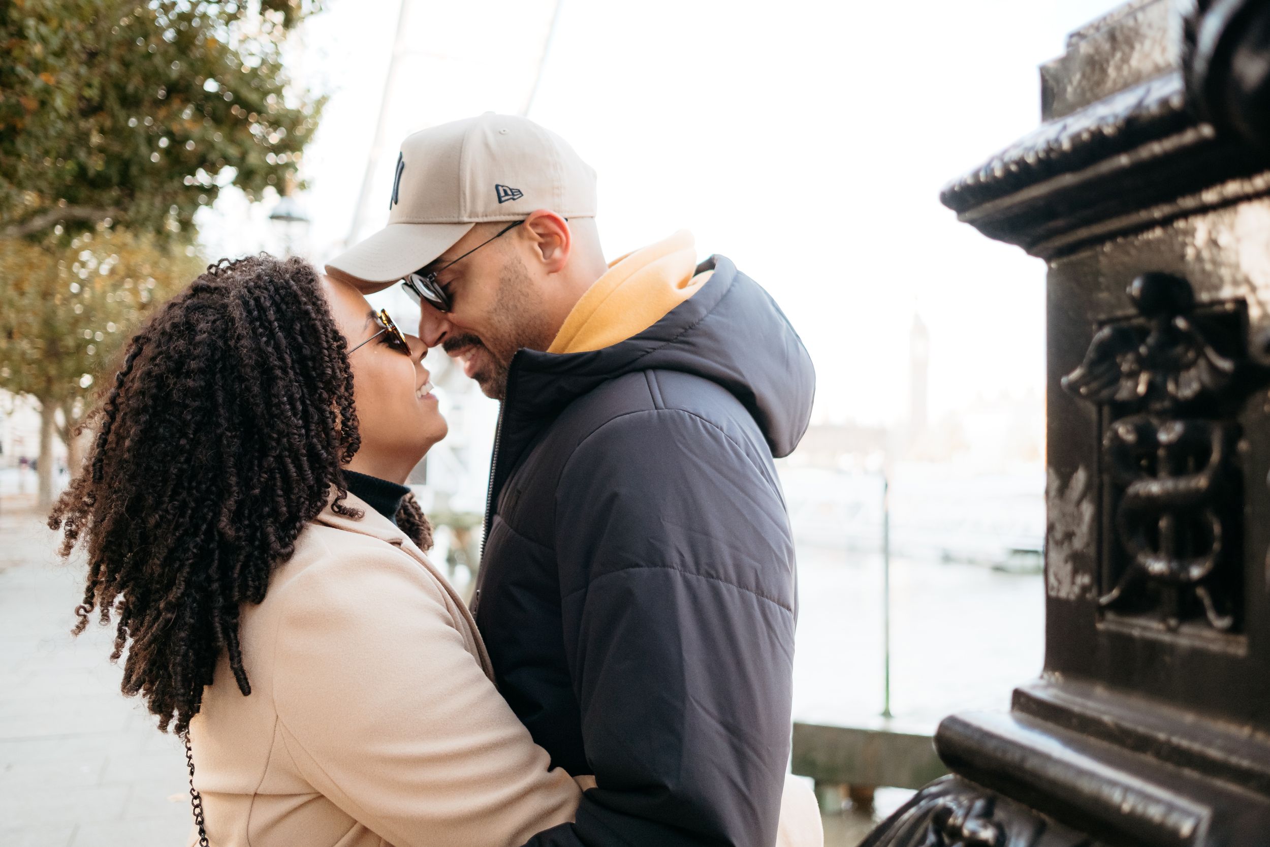 Close up of couple sharing an intimate moment outdoors.