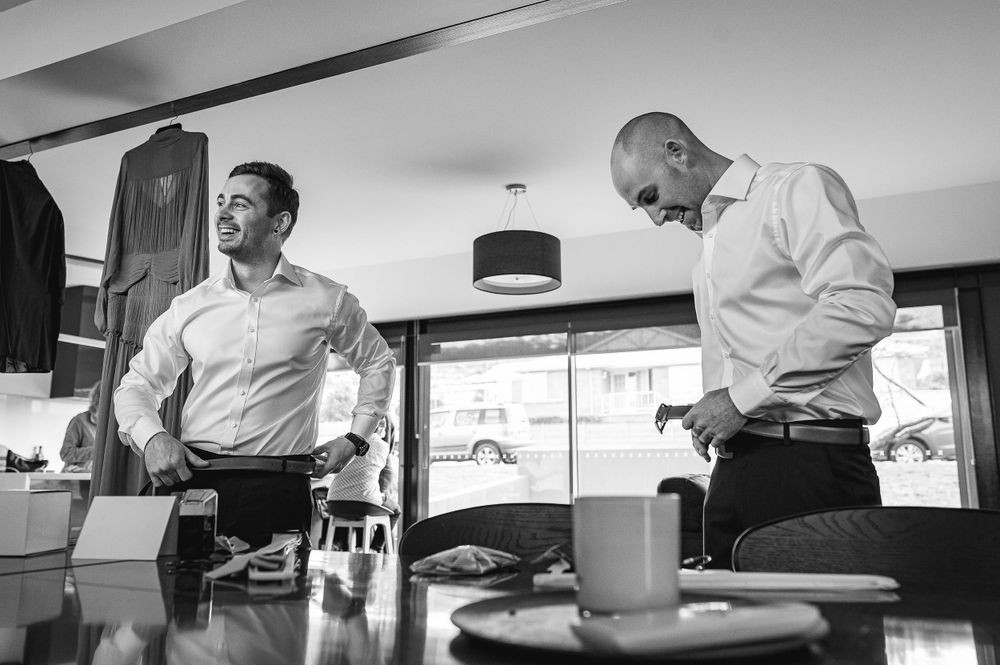 Two people in business attire interacting in an office setting.