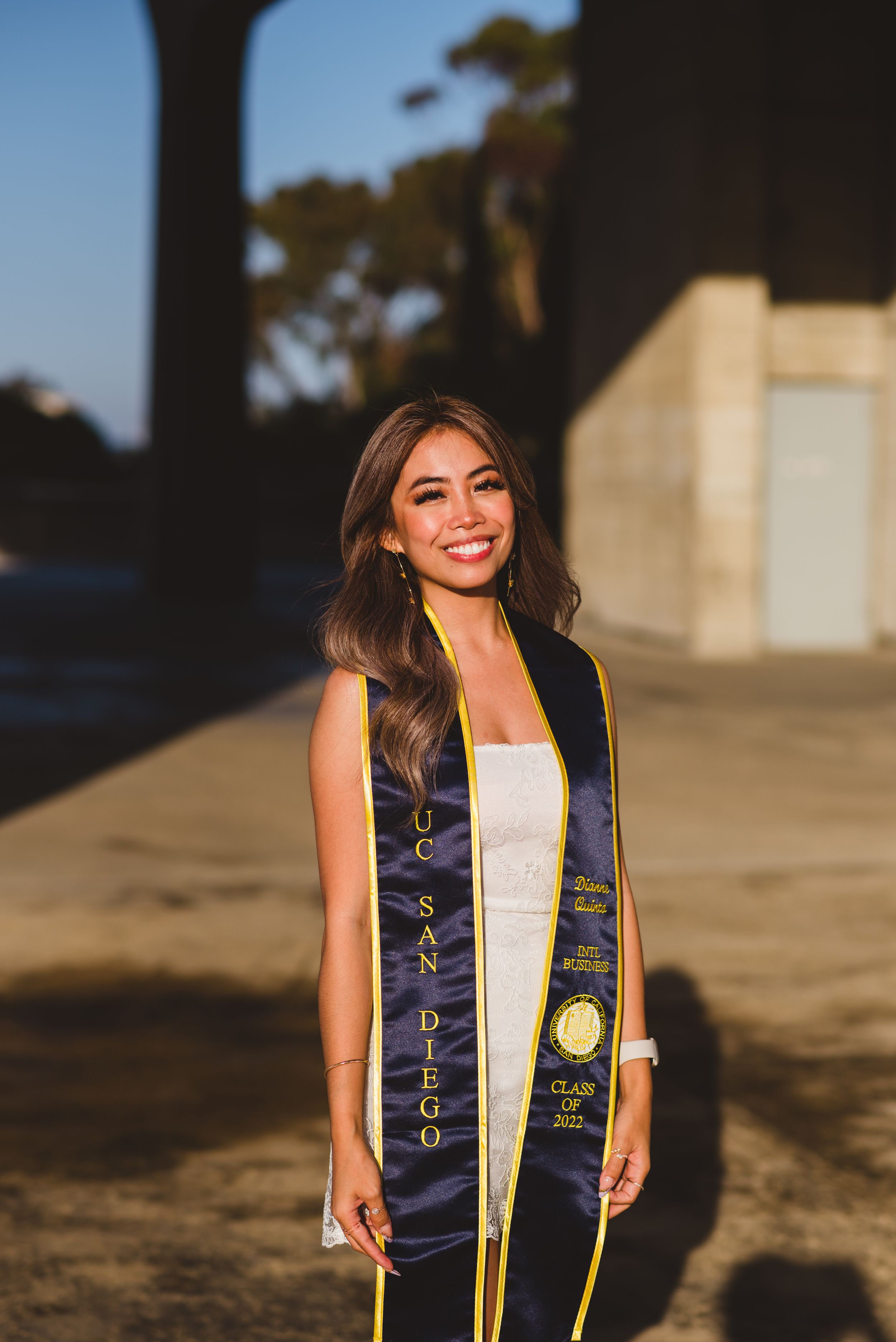 UC San Diego graduate posing for a photo at Geisel,