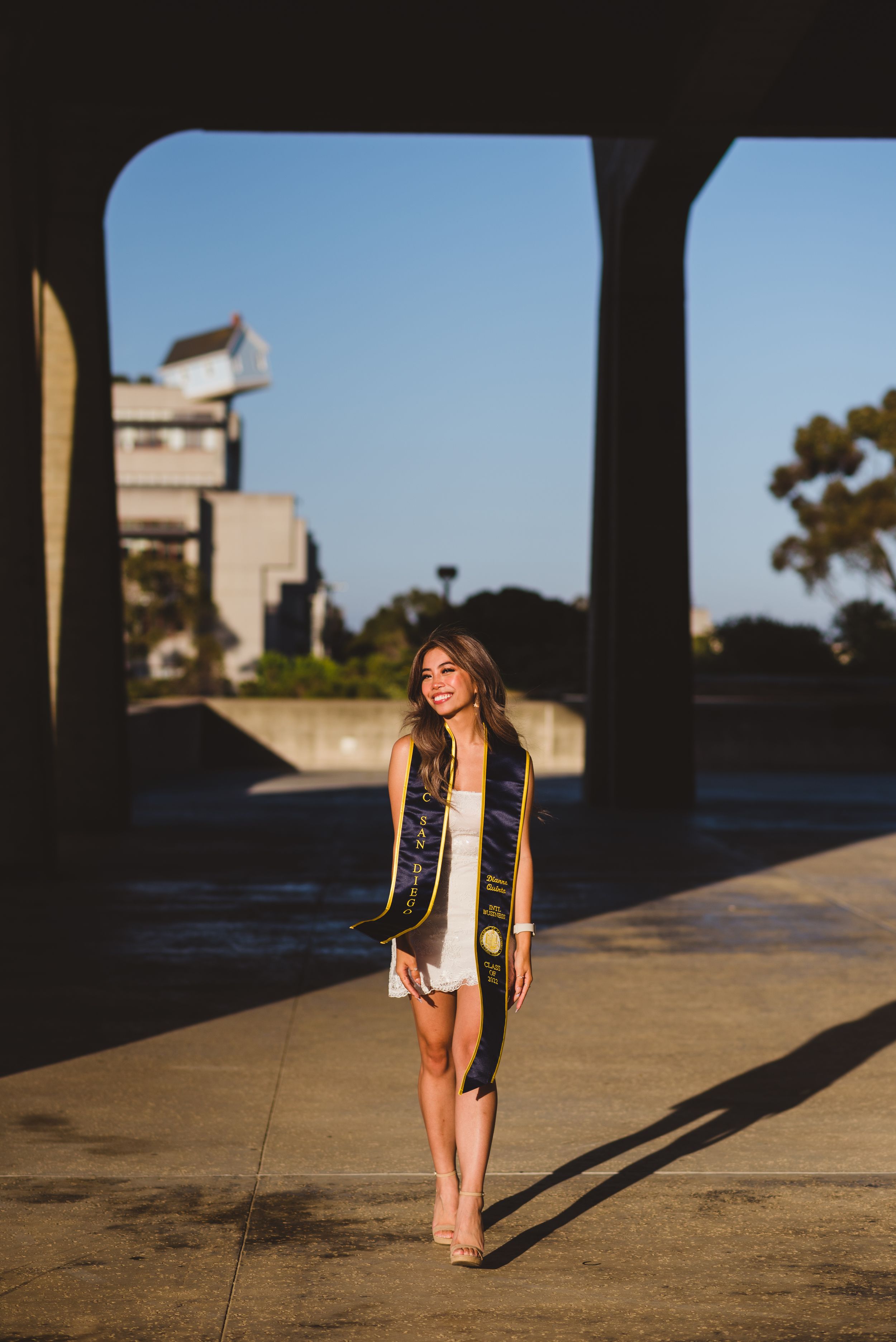 UC San Diego graduate posing for a photo with falling star.