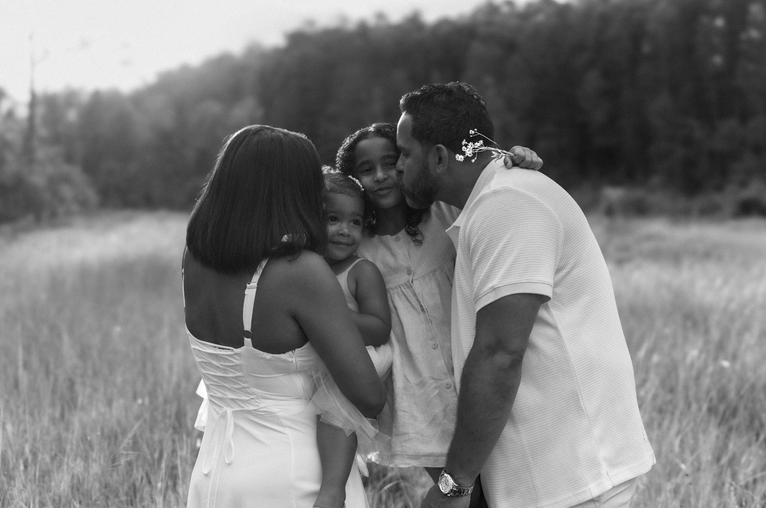 Pinterest-worthy family hug in a field