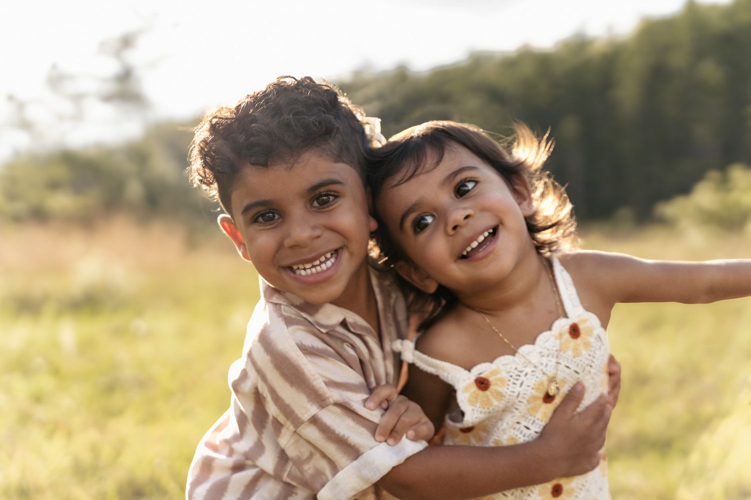 Outdoor family laughter surrounded by greenery