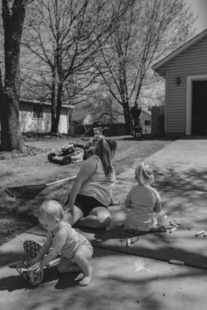 Relaxing in the driveway while dad does lawncare, baby on the way