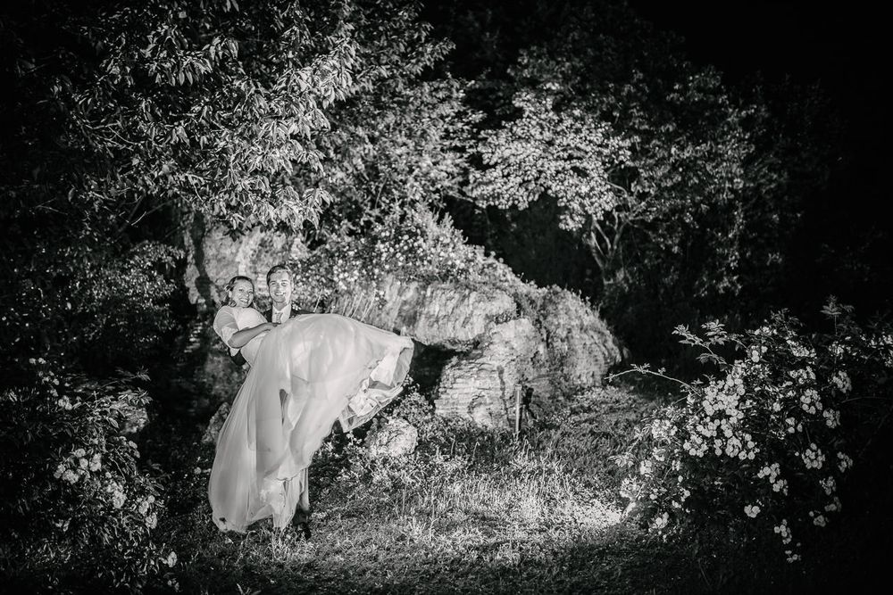 Black and white landscape photos showing a wedding couple among natural foliage.