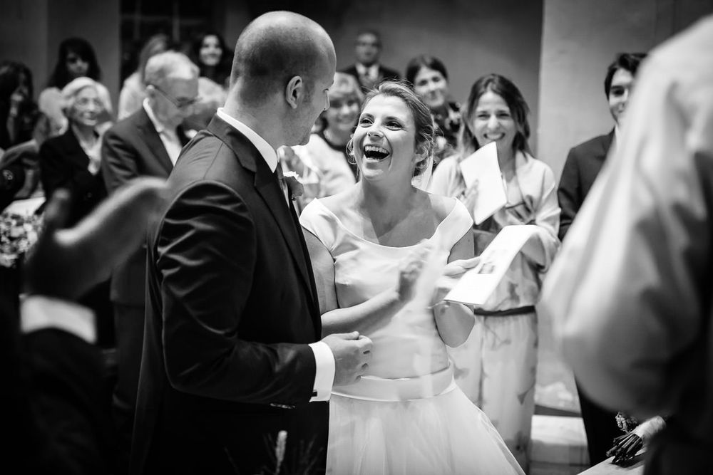 Wedding party dancing and celebrating together during a joyful reception celebration.