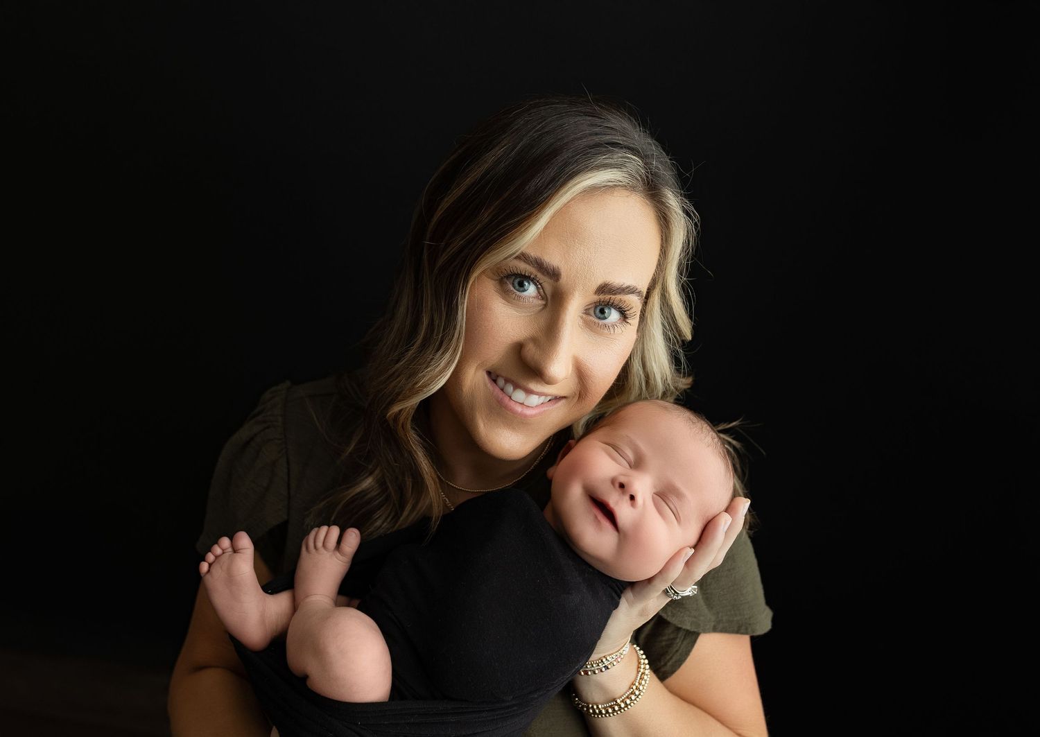 Mother is holding newborn son. Greenville SC newborn photographer, Easley, SC newborn photographer