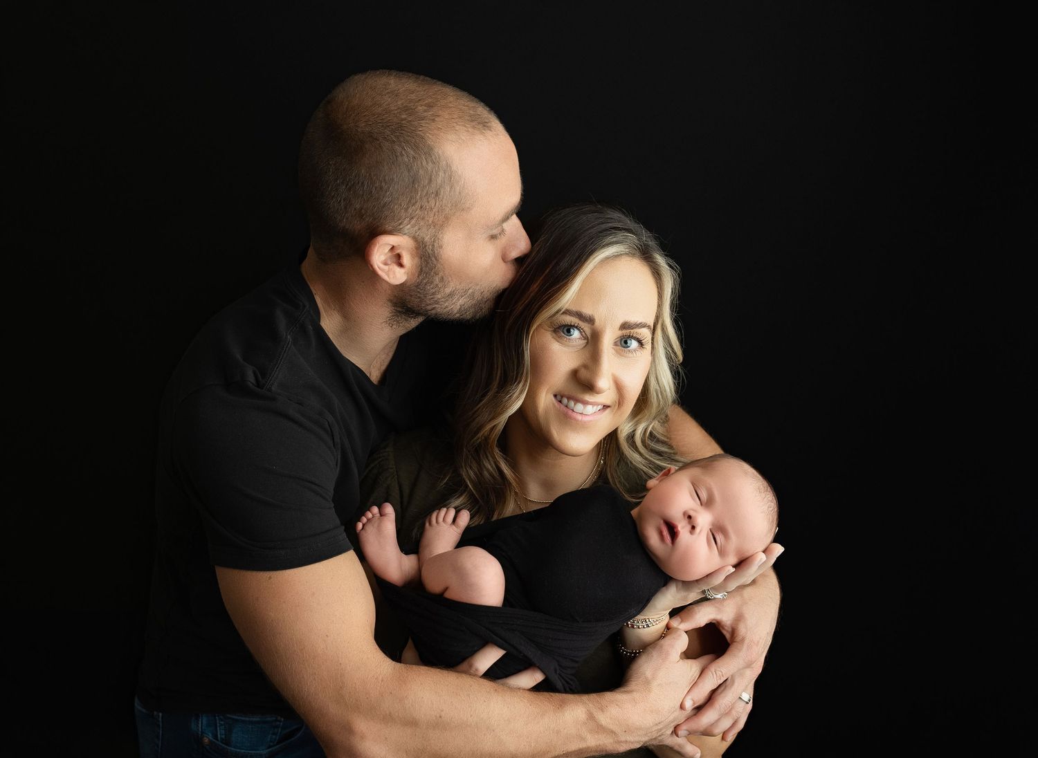 Mom and Dad are holding a newborn boy. Greenville SC newborn photographer, Easley, SC newborn photographer
