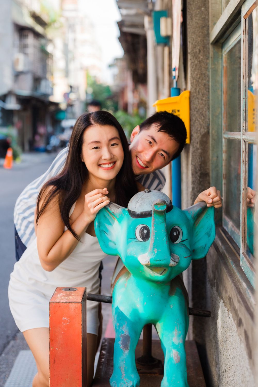 A playful couple at Dihua Street in Dadaocheng District in Taipei City.