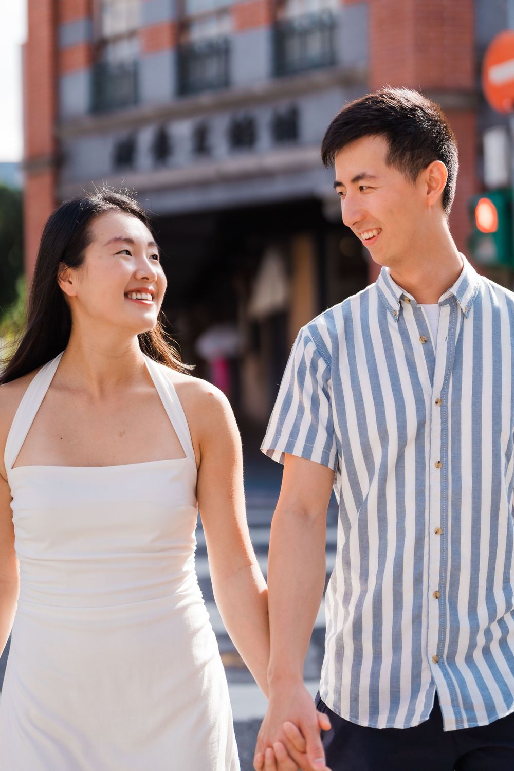 A couple holding hands at Dihua Street in Dadaocheng District in Taipei City.