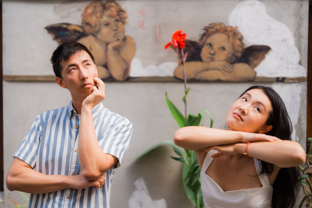 A couple posing with the background at Dihua Street in Dadaocheng, Taipei City.