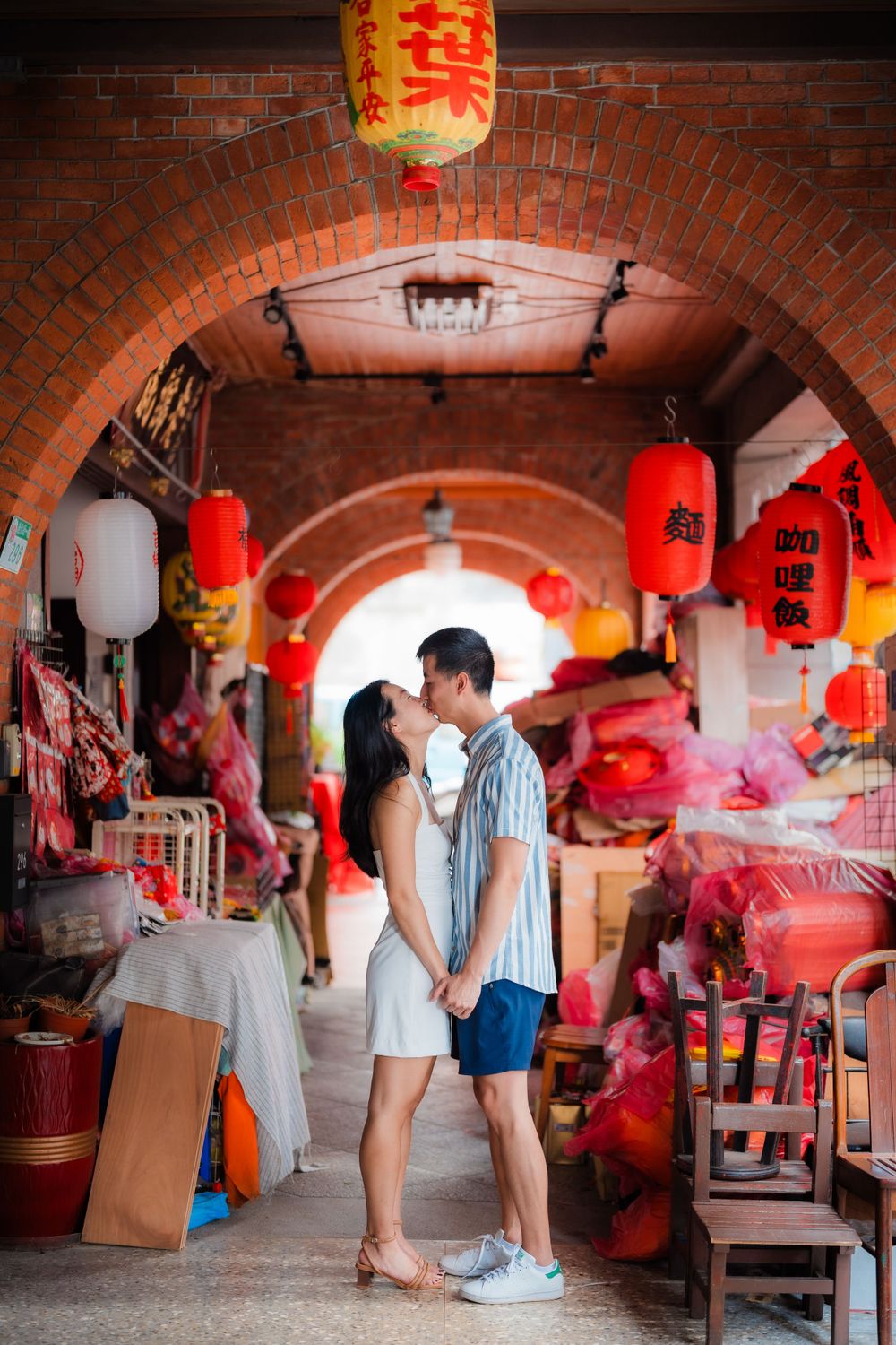 A couple kissing at Dihua Street in Dadaocheng, Taipei City.