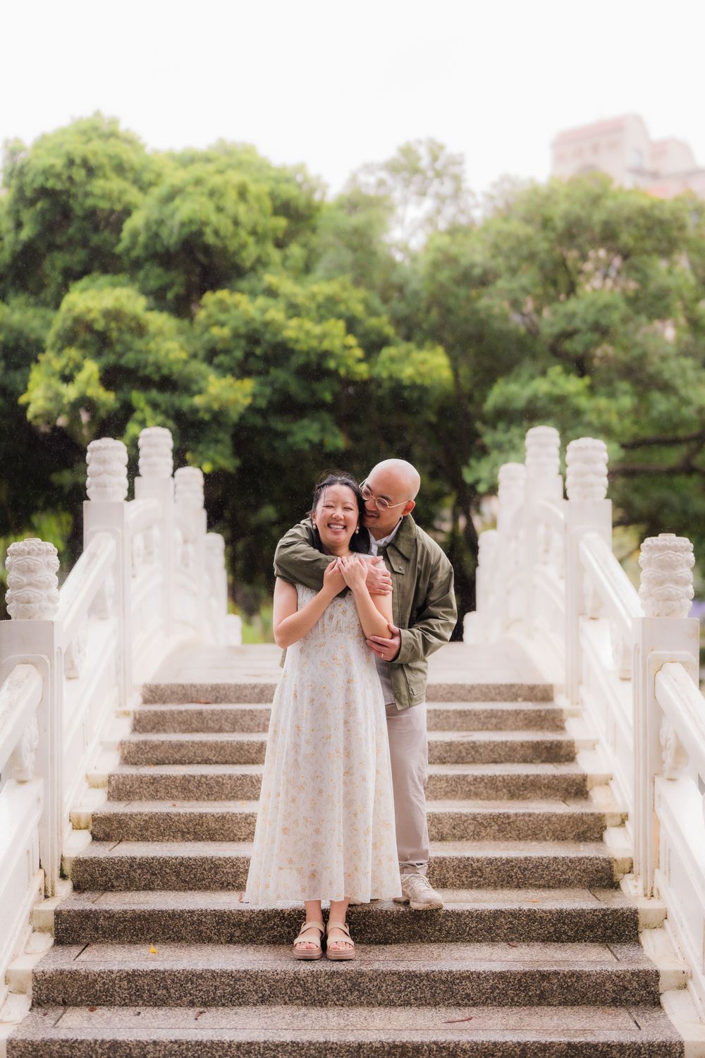 A couple on the stairs of a bridge at CKS Memorial Hall in Taipei City.