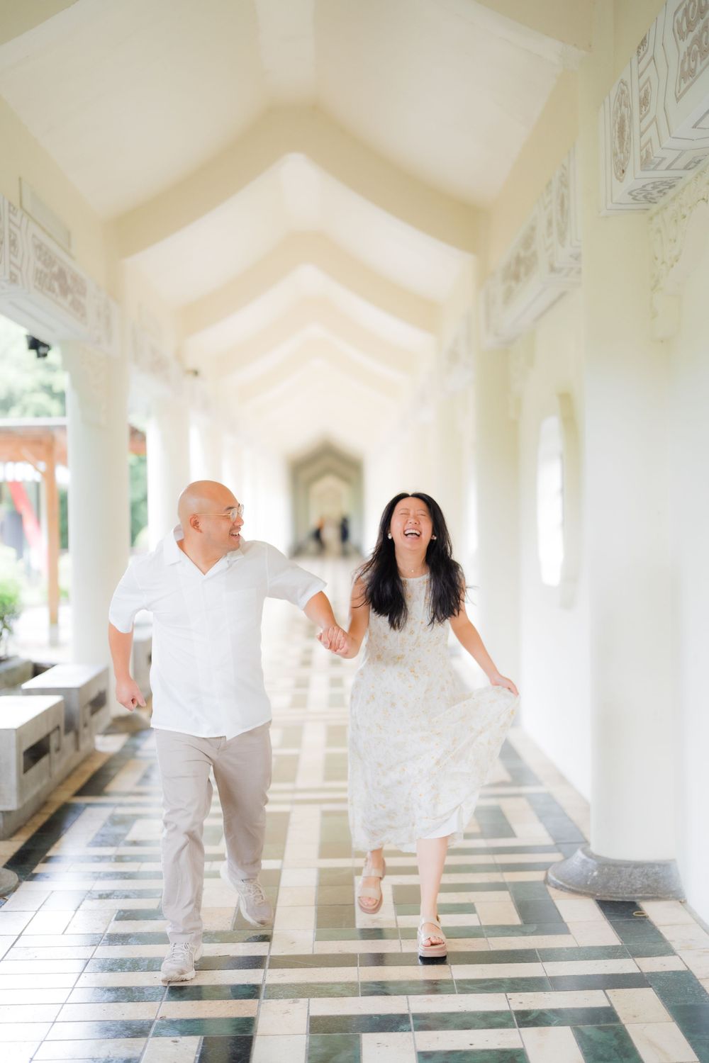 A couple holding hands at Chiang Kai-shek Memorial Hall in Taipei City.