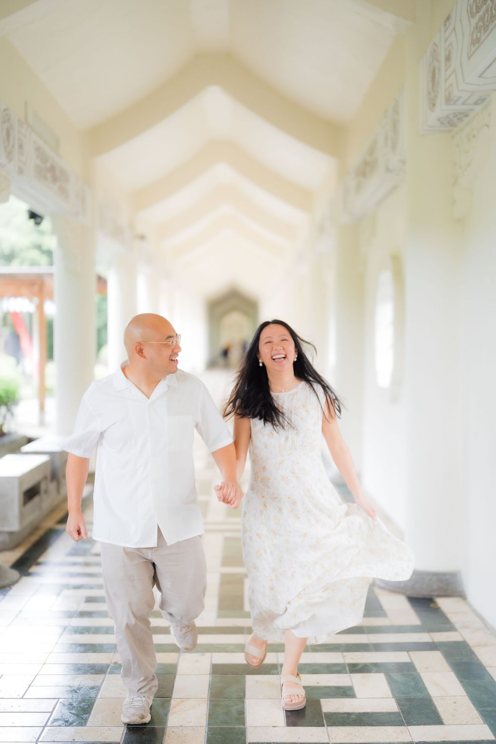 A couple holding hands at Chiang Kai-shek Memorial Hall in Taipei City.