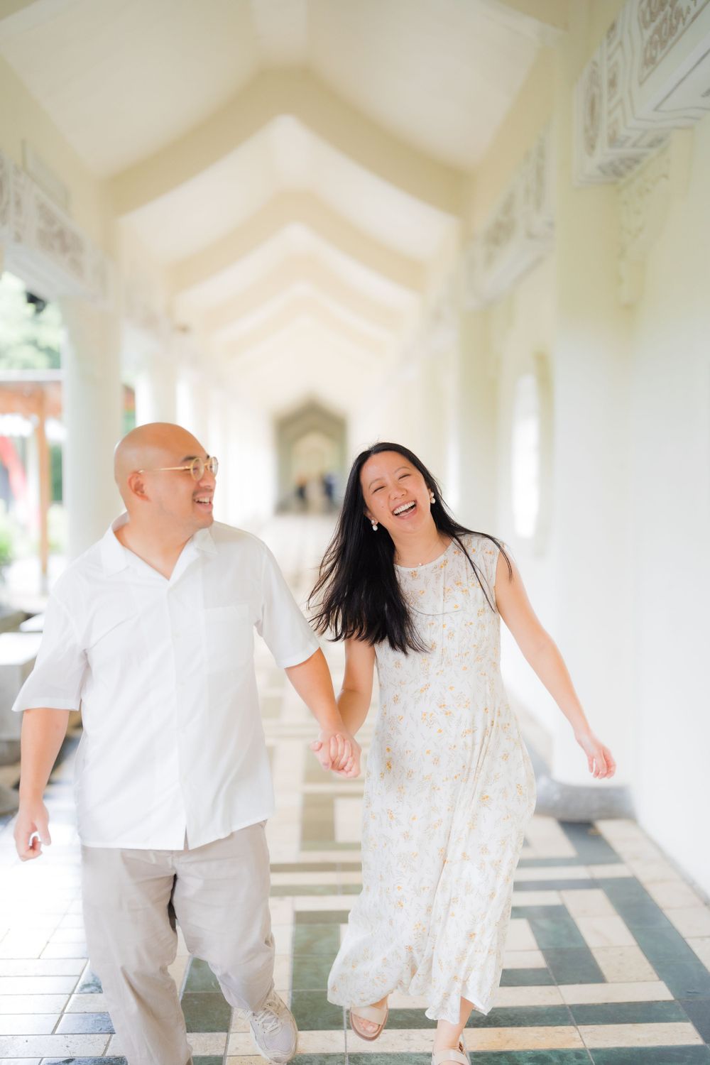 A couple holding hands at Chiang Kai-shek Memorial Hall in Taipei City.