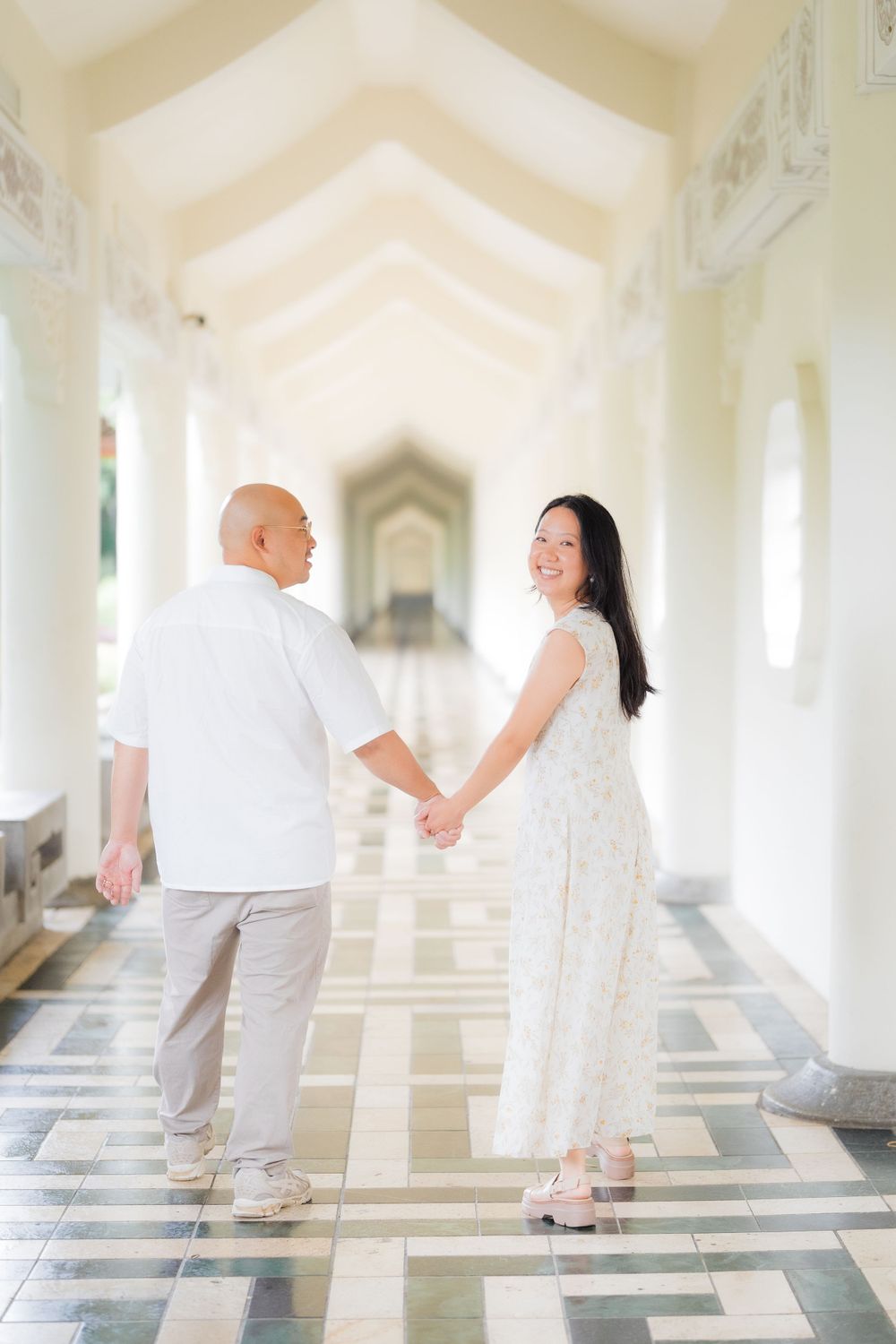 A couple holding hands at Chiang Kai-shek Memorial Hall in Taipei City.
