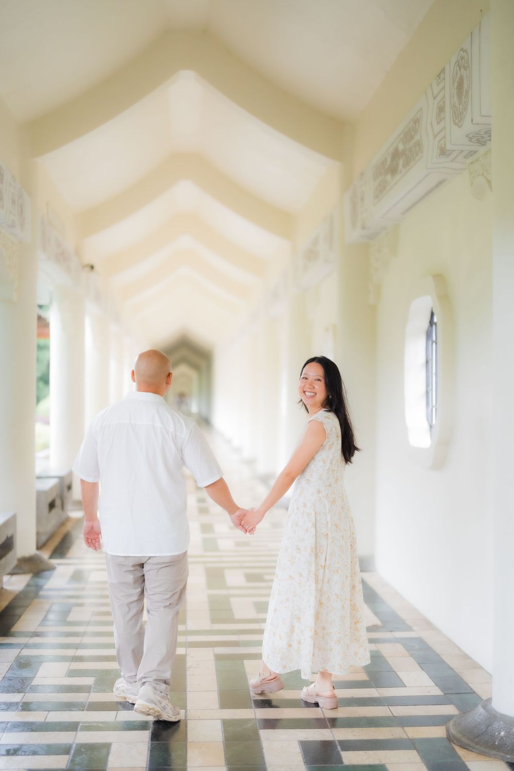 A couple holding hands at Chiang Kai-shek Memorial Hall in Taipei City.
