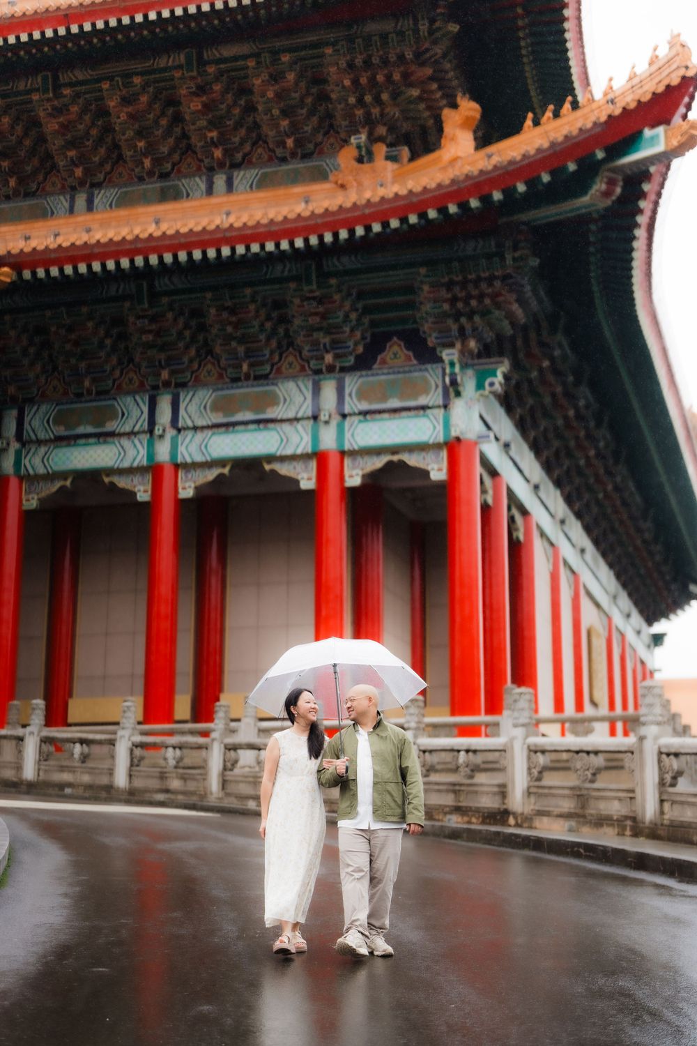 A couple at Chiang Kai-shek Memorial Hall in Taipei City on a rainy day.