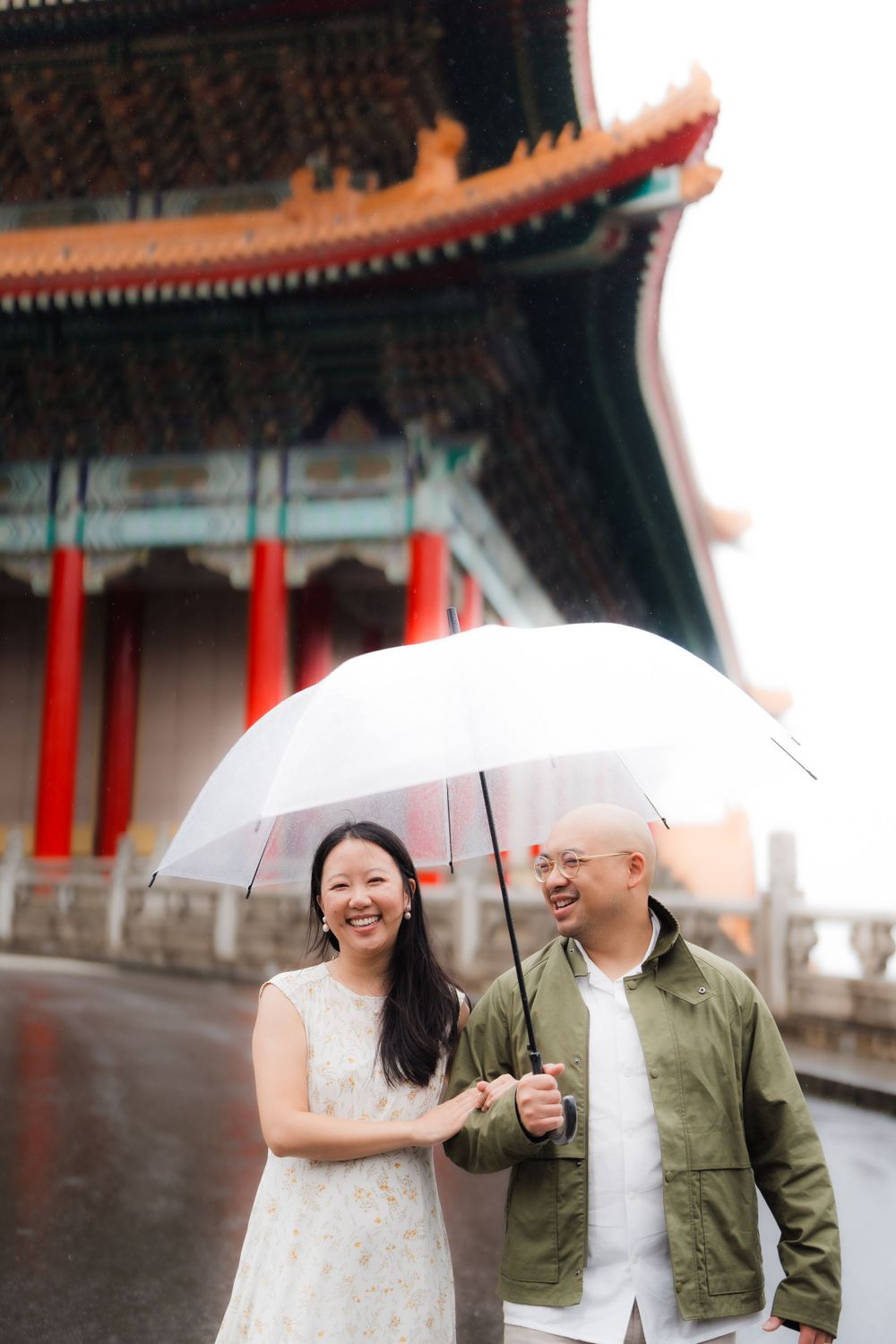 A couple at Chiang Kai-shek Memorial Hall in Taipei City on a rainy day.
