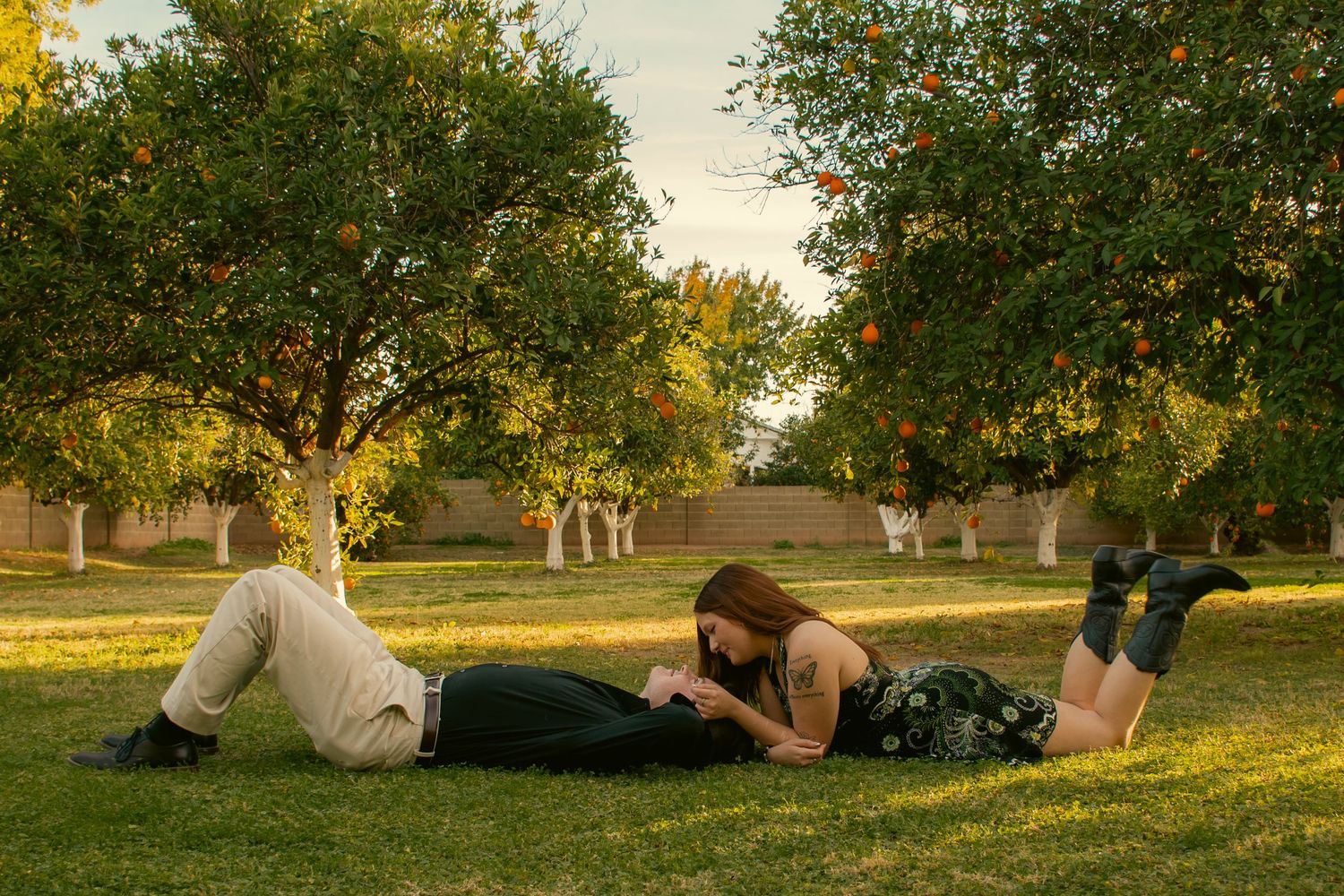 Couple shared a quiet moment together in a cinematic scene in an Orange patch in Mesa, Arizona.