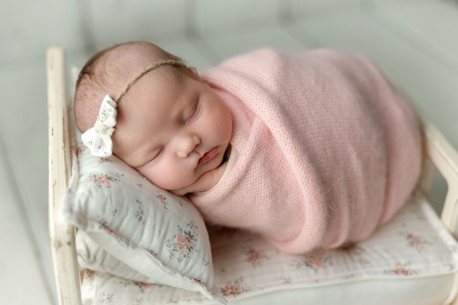 Newborn in pink on a bed. Greenville SC newborn photographer, Easley, SC newborn photographer, Upstate newborn photographer