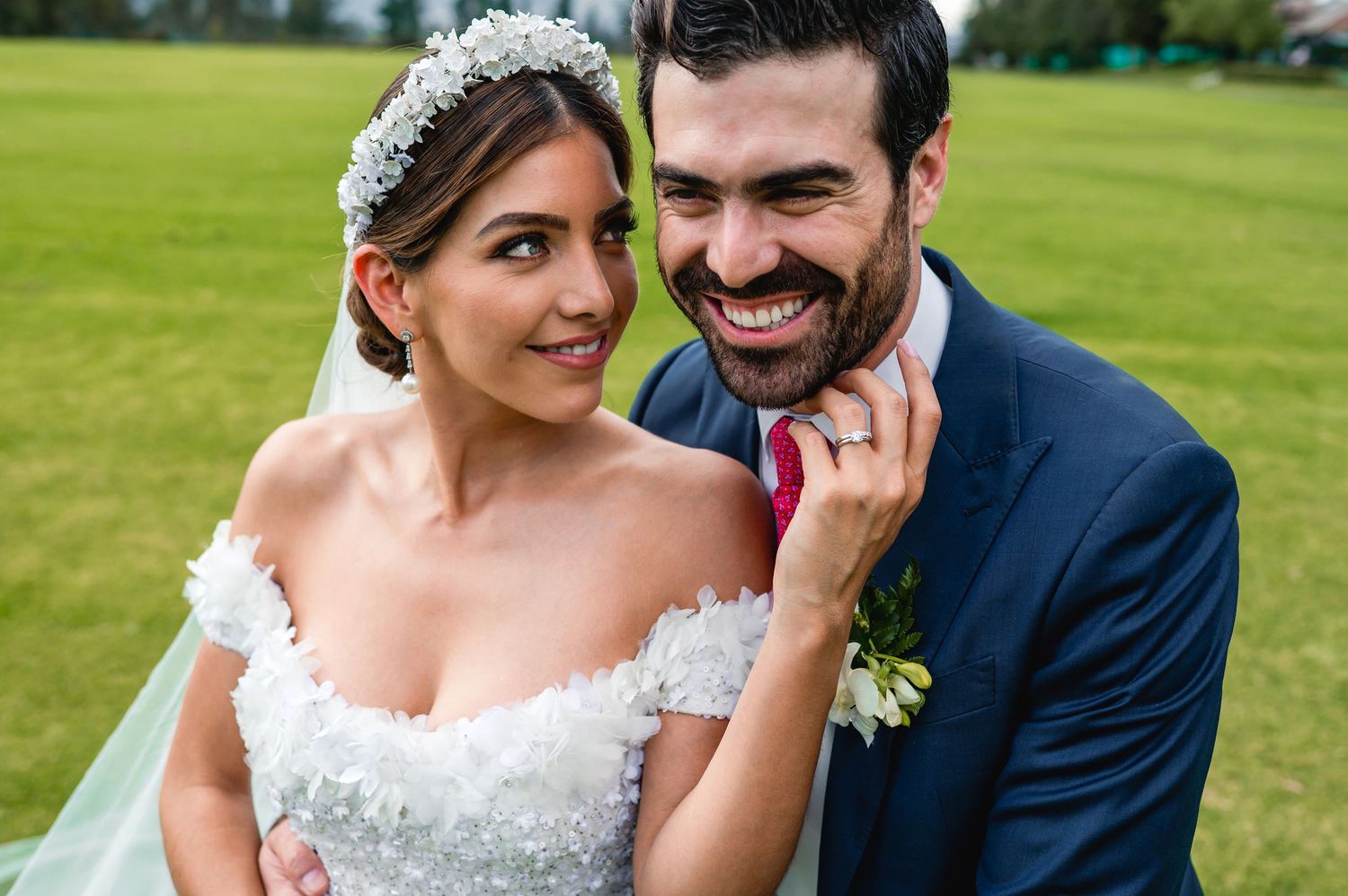 Candid moments shared on a bright green golf course during a wedding photoshoot.