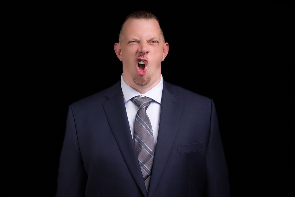A set of professional headshot photos showing expressions ranging from serious to laughing in business attire.