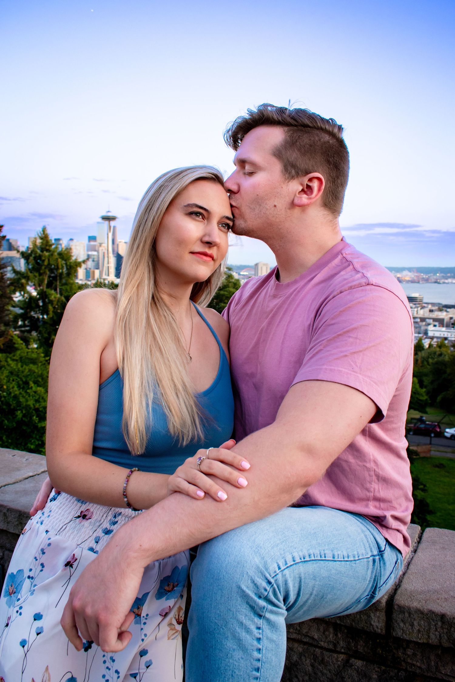 Playful couples photo session at the Seattle Kerry Park during sunset.