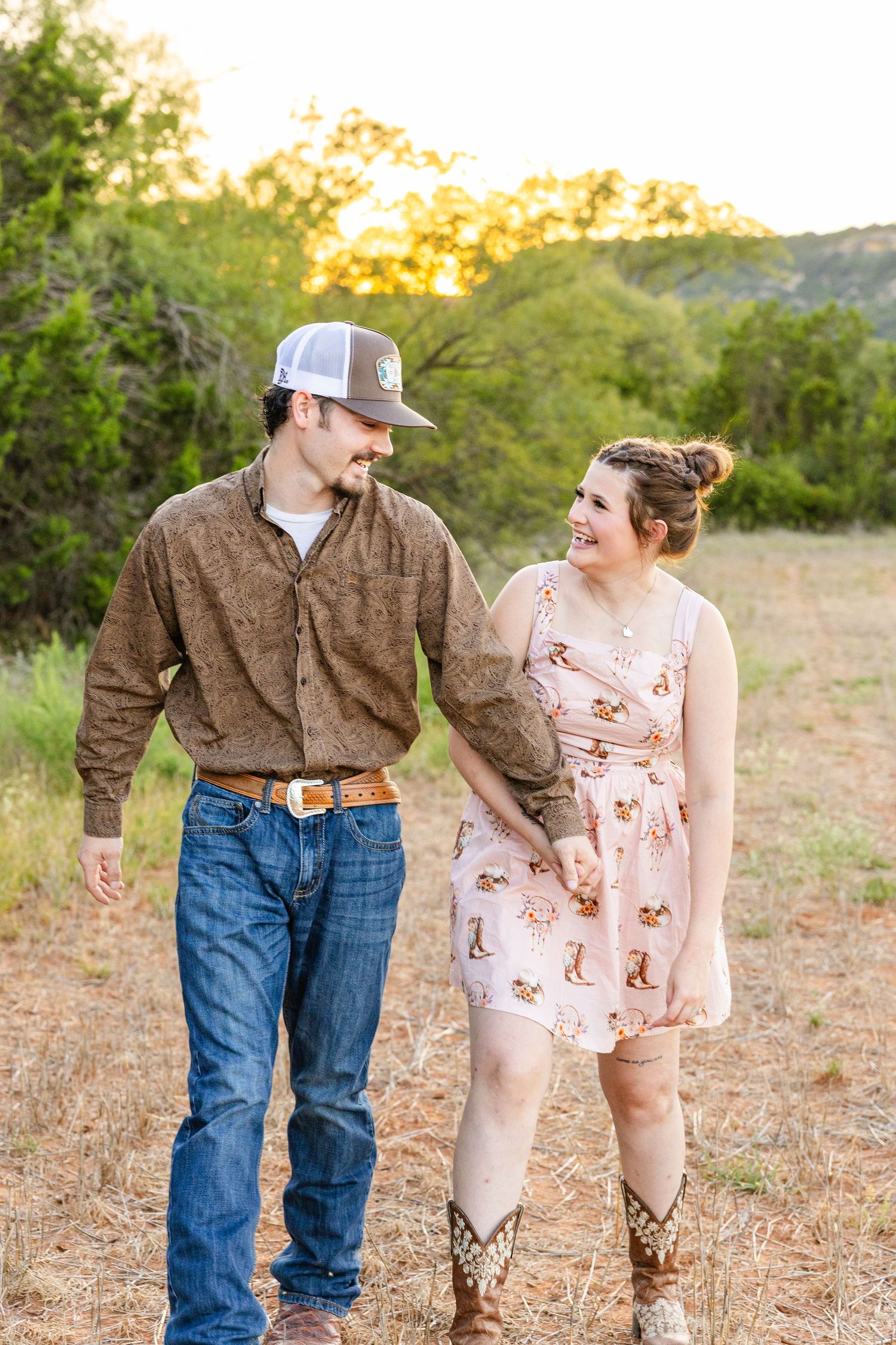 married couple in a field at golden hour in buffalo gap texas photography session