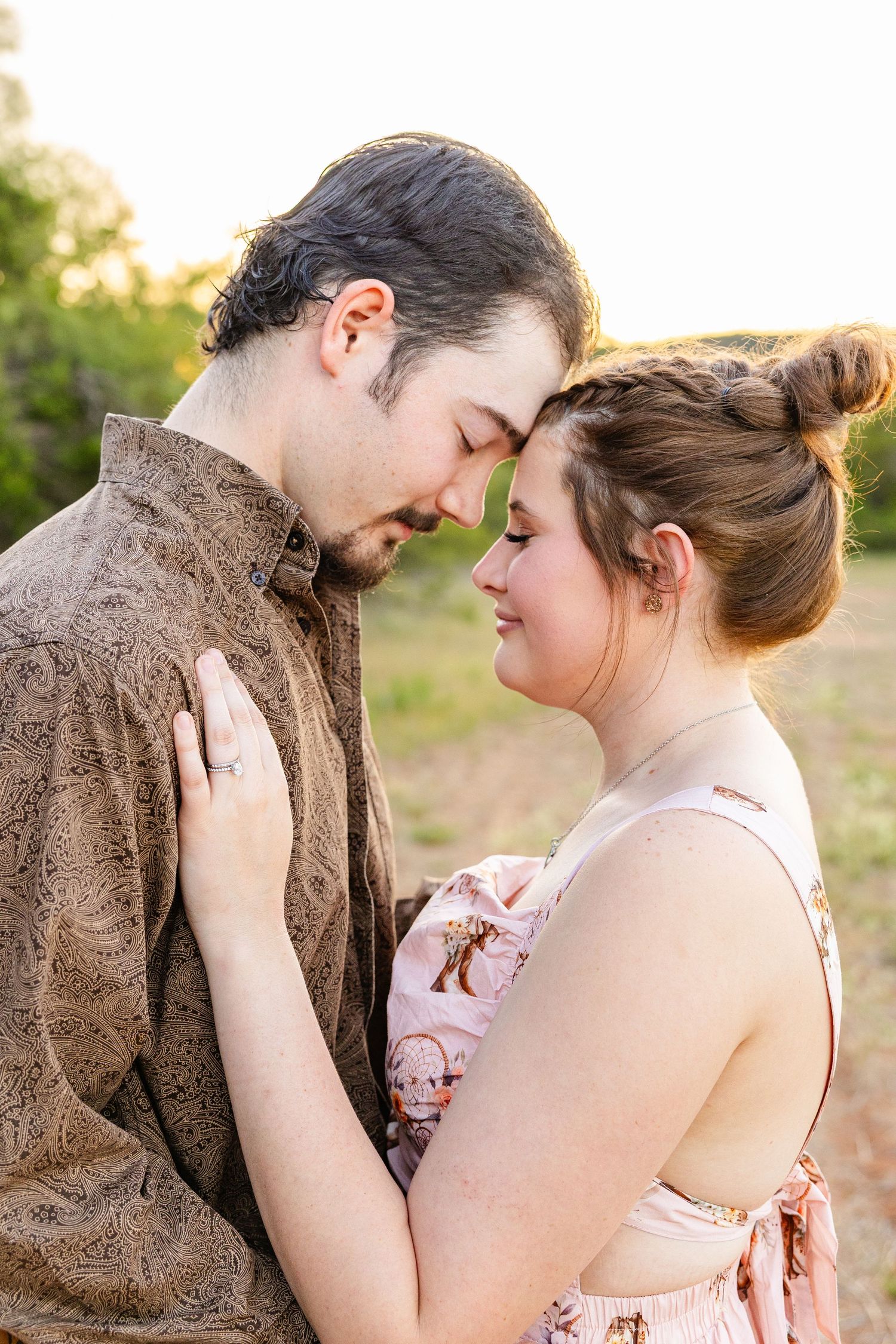 married couple in a field at golden hour in buffalo gap texas photography session