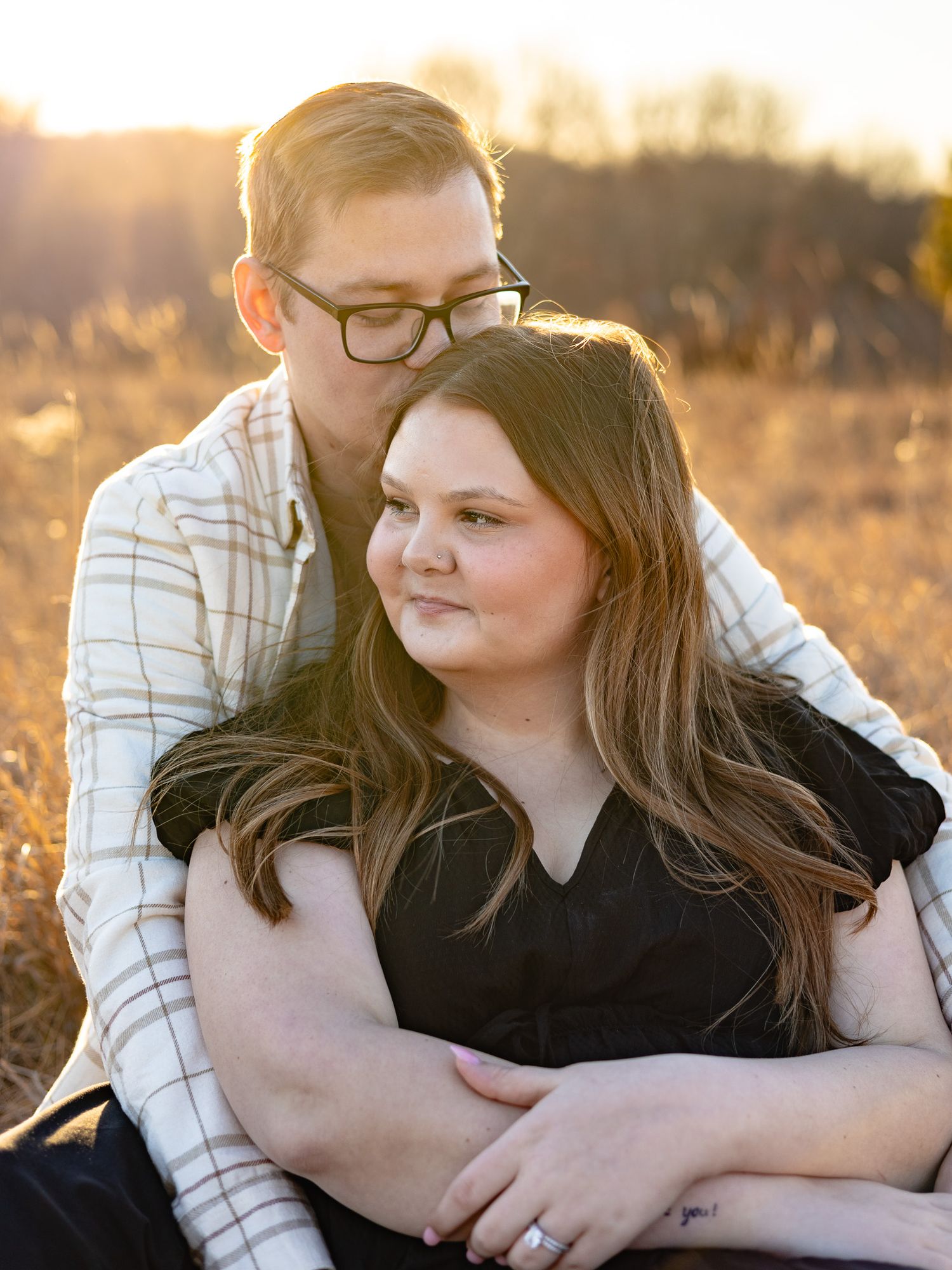 married couple posing during golden hour
