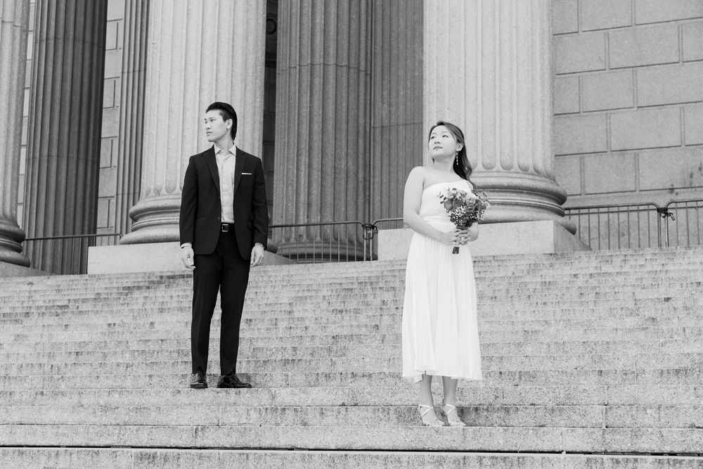 A series of black and white wedding photos showing a bride and groom posing on grand stone steps of a building.
