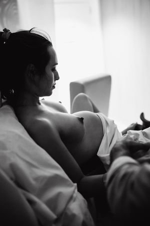Black and white images showing intimate moments during labor and delivery.