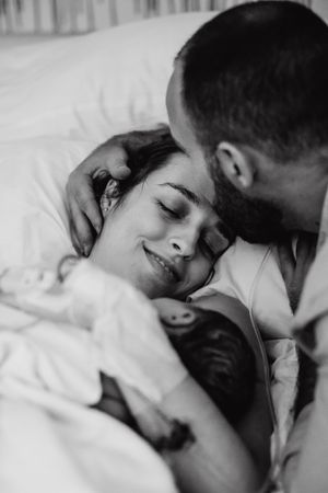 Romantic black and white portrait showing affection between a couple.