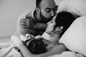 Close-up black and white photograph capturing an intimate embrace.