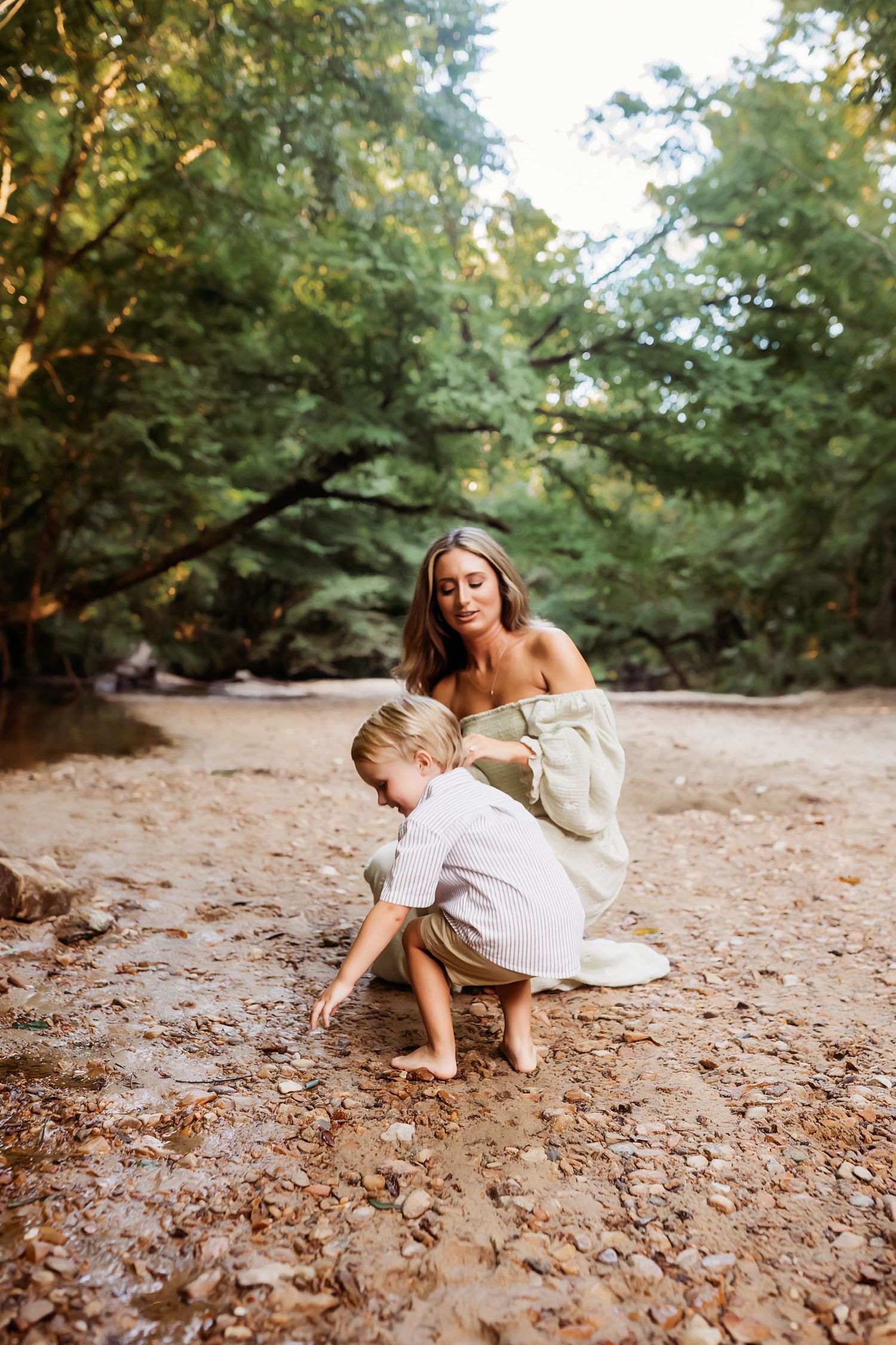 A sequence of photos shows someone in a white dress gracefully moving and exploring along a rustic dirt path in a wooded area.