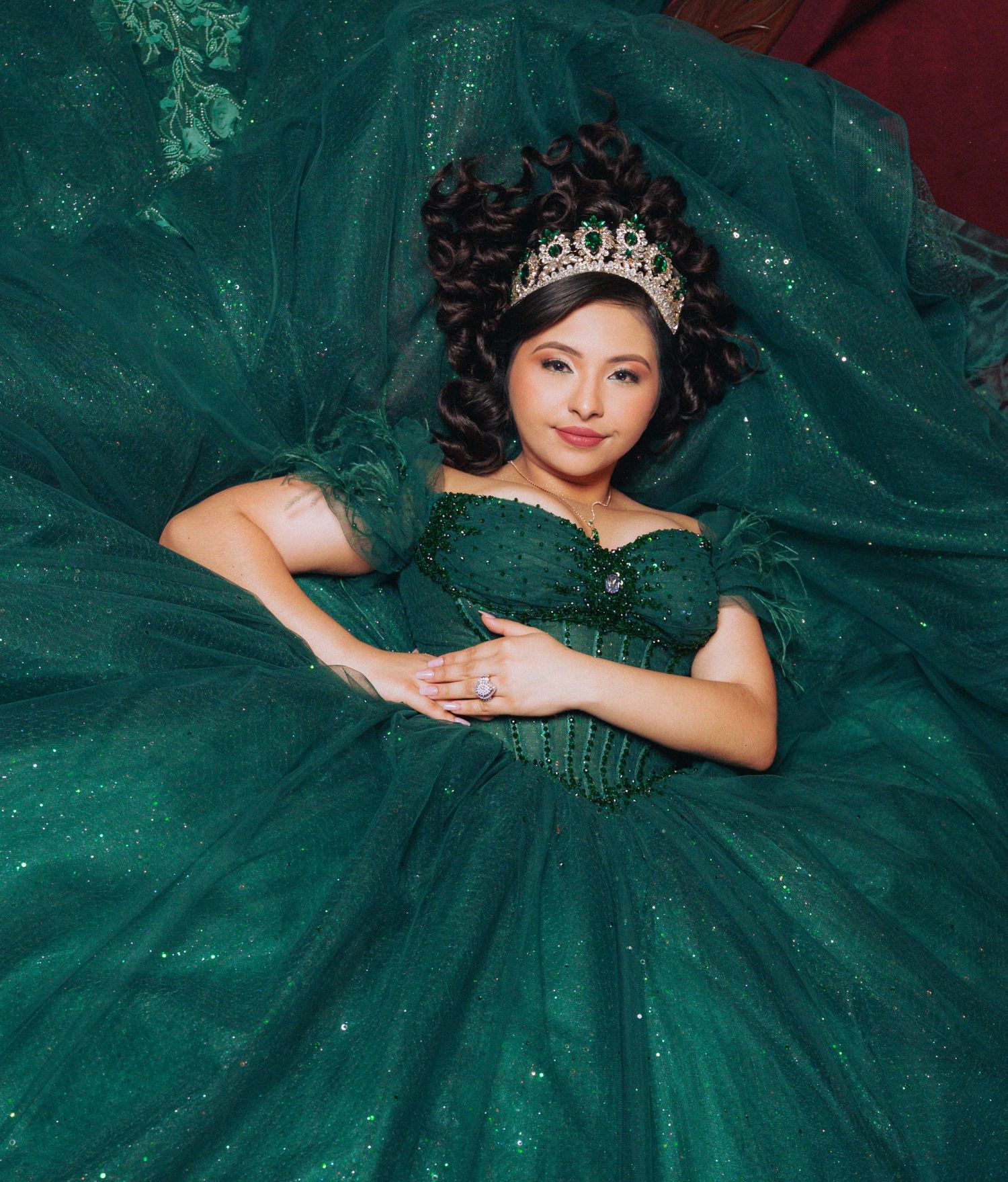 Sparkling emerald green ballgown with intricate beadwork and full tulle skirt.