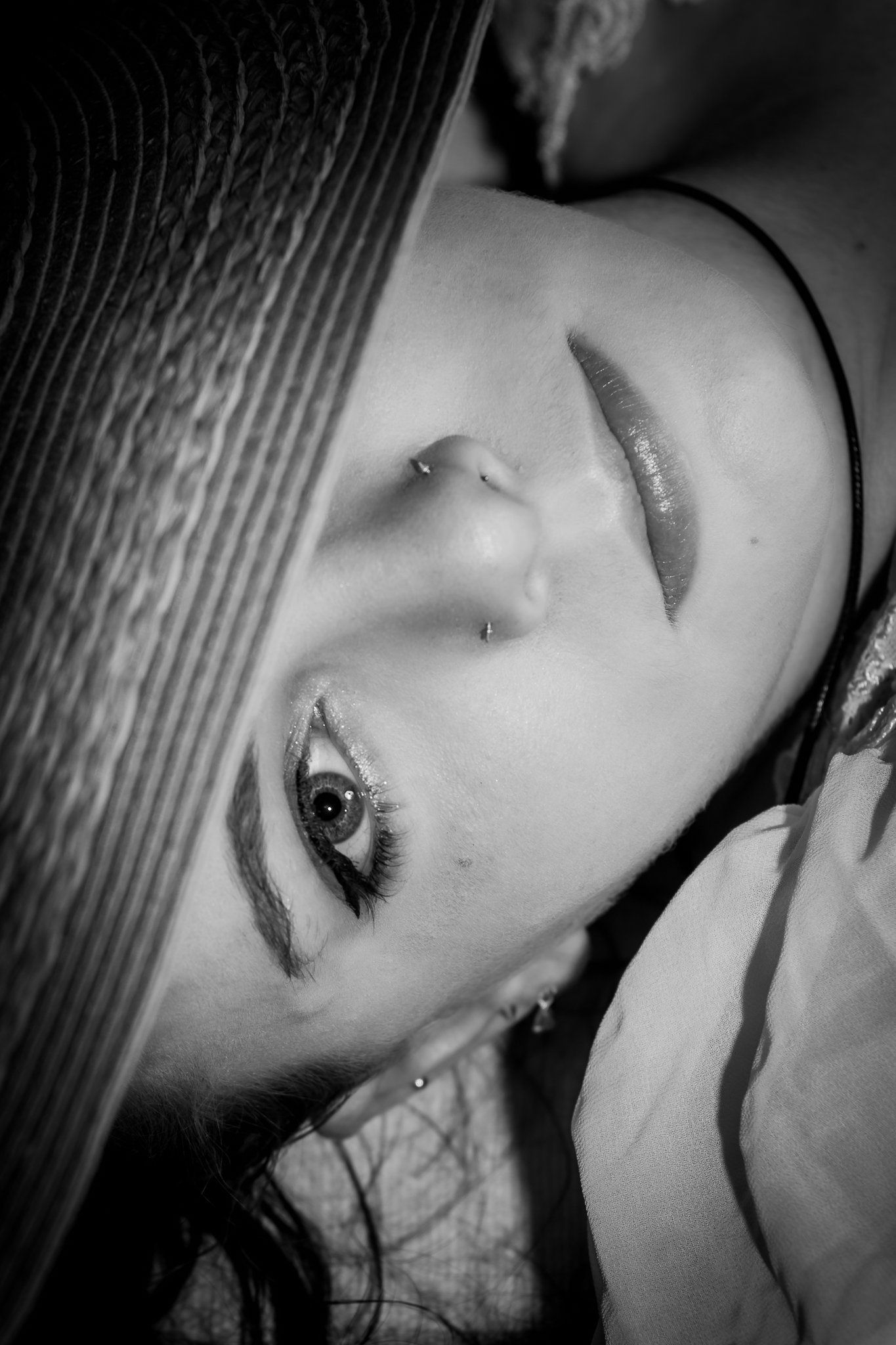 Artistic black and white close-up beauty portrait with eye focus.